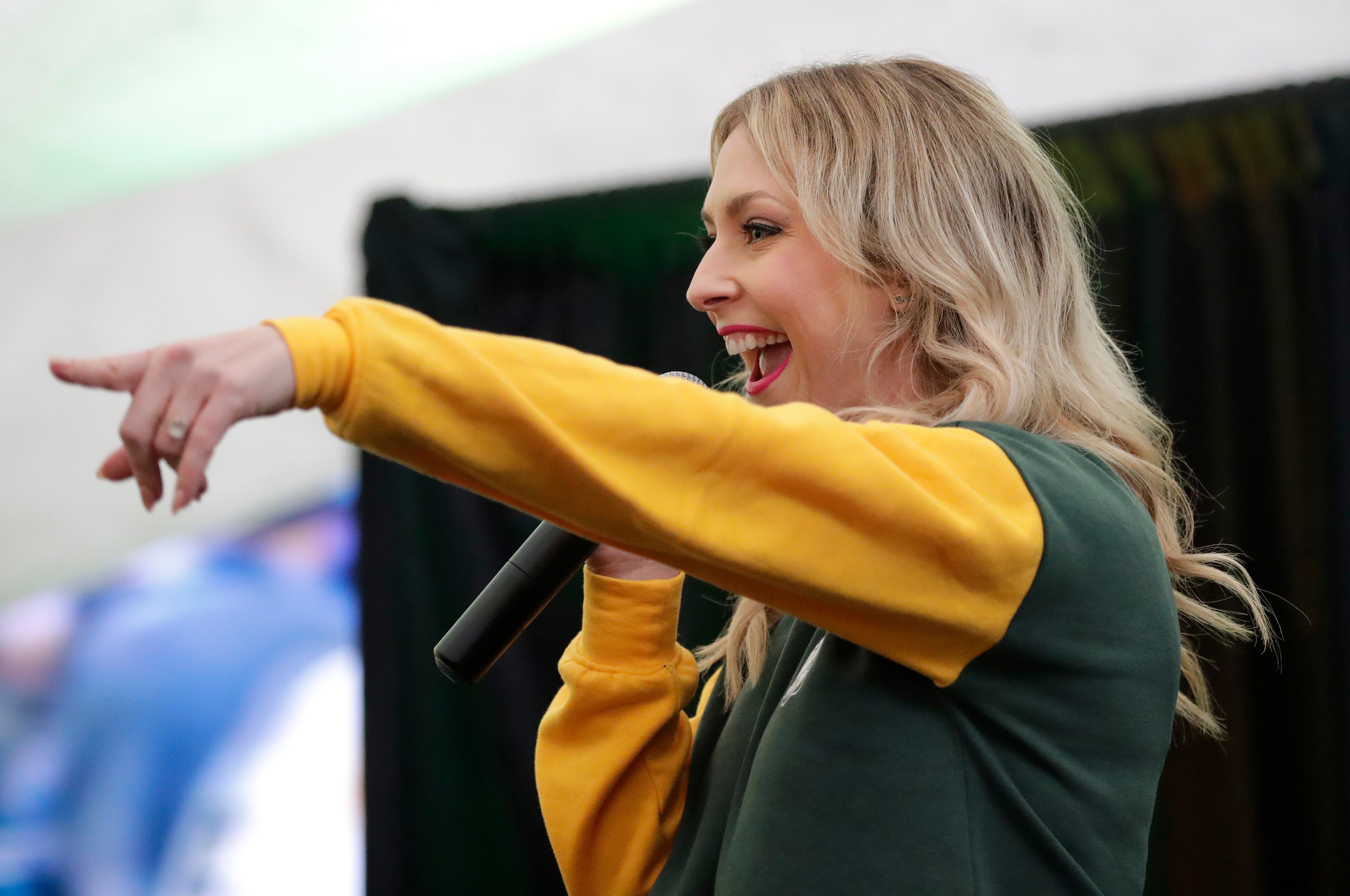 Packers Everywhere host Rebecca Zaccard gets the crowd pumped up during the Packers Everywhere pep rally Friday, January 19, 2024, at The Patio in Palo Alto, California.