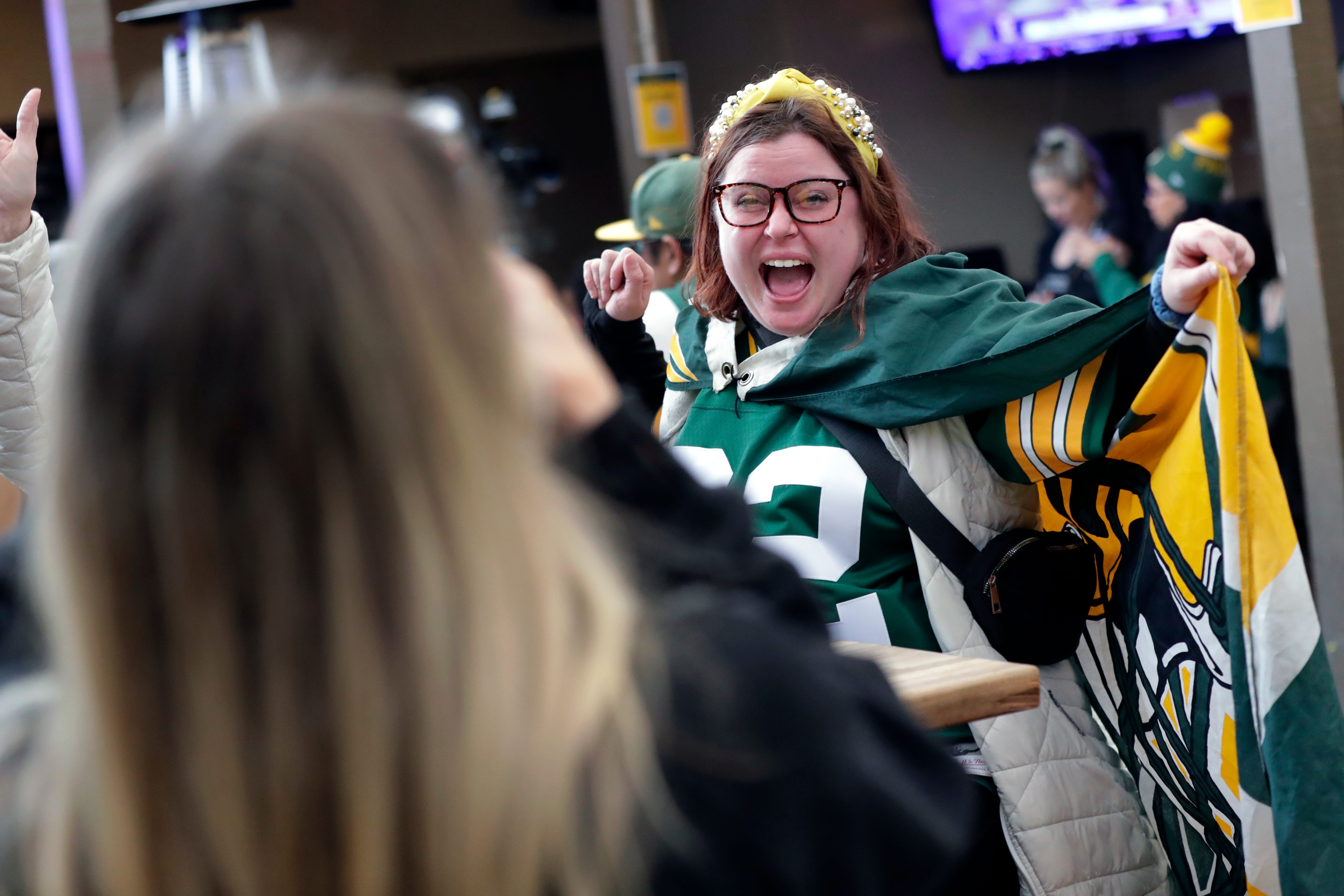 Green Bay Packers fan Emma Wilson of Portland, Oregon poses for a pictured dressed in a Packers cape and tiara during the Packers Everywhere pep rally Friday, January 19, 2024, at The Patio in Palo Alto, California.