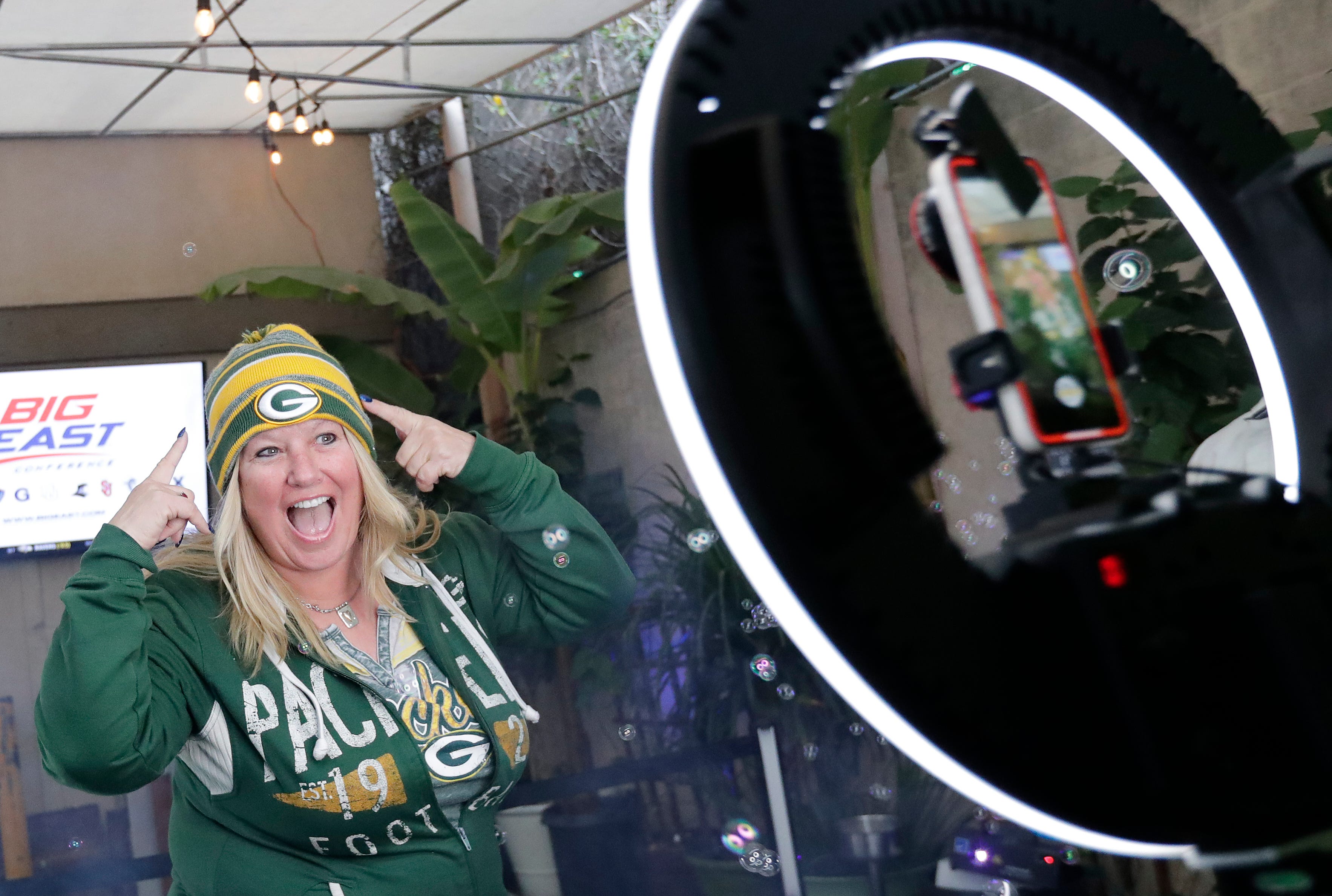 Green Bay Packers fan Shelly Seebeck of Las Vegas, Nevada, has fun creating a 360-degree video during the Packers Everywhere pep rally Friday, January 19, 2024, at The Patio in Palo Alto, California.