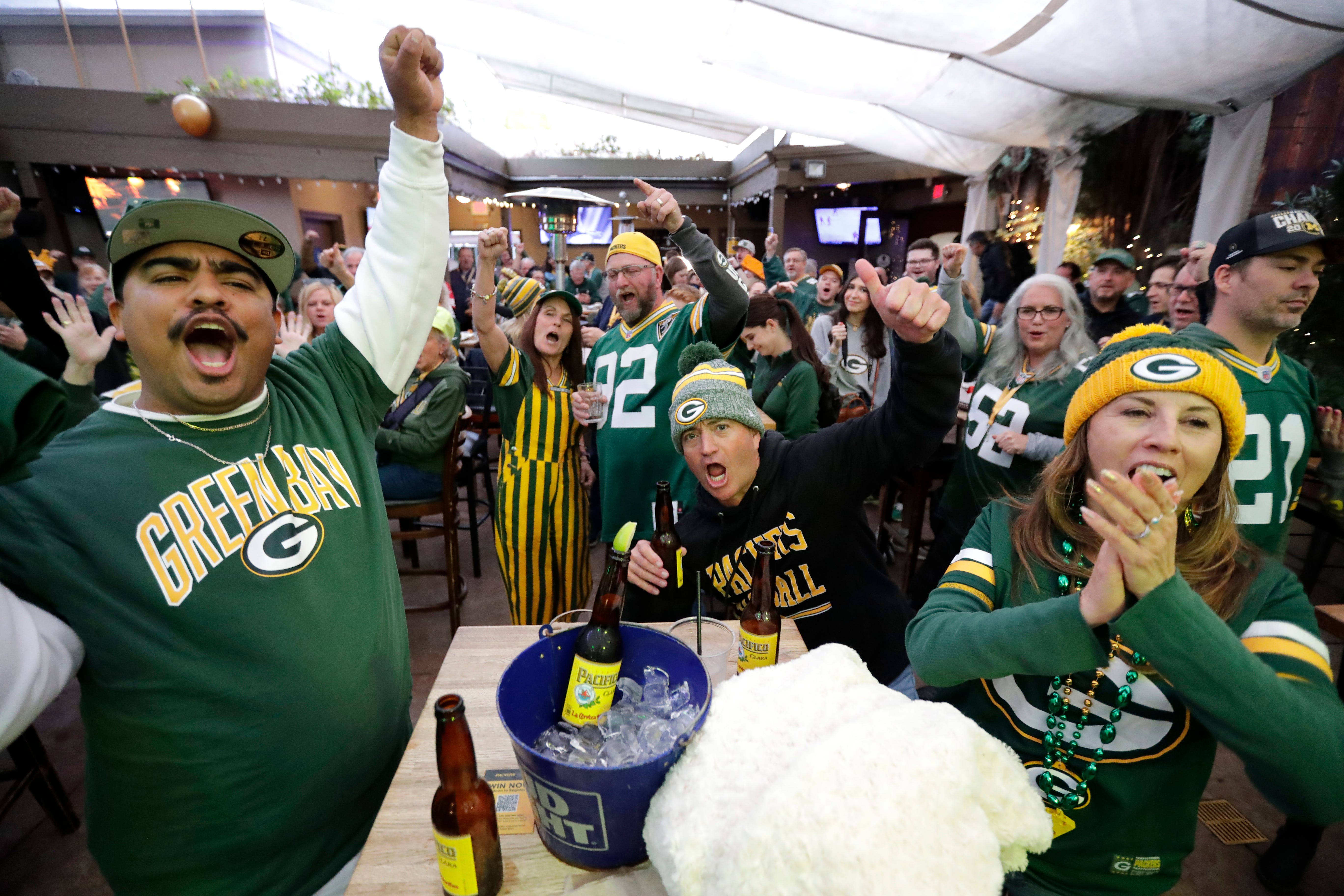 Green Bay Packers fans cheer “Go Pack Go” during the Packers Everywhere pep rally Friday, January 19, 2024, at The Patio in Palo Alto, California.