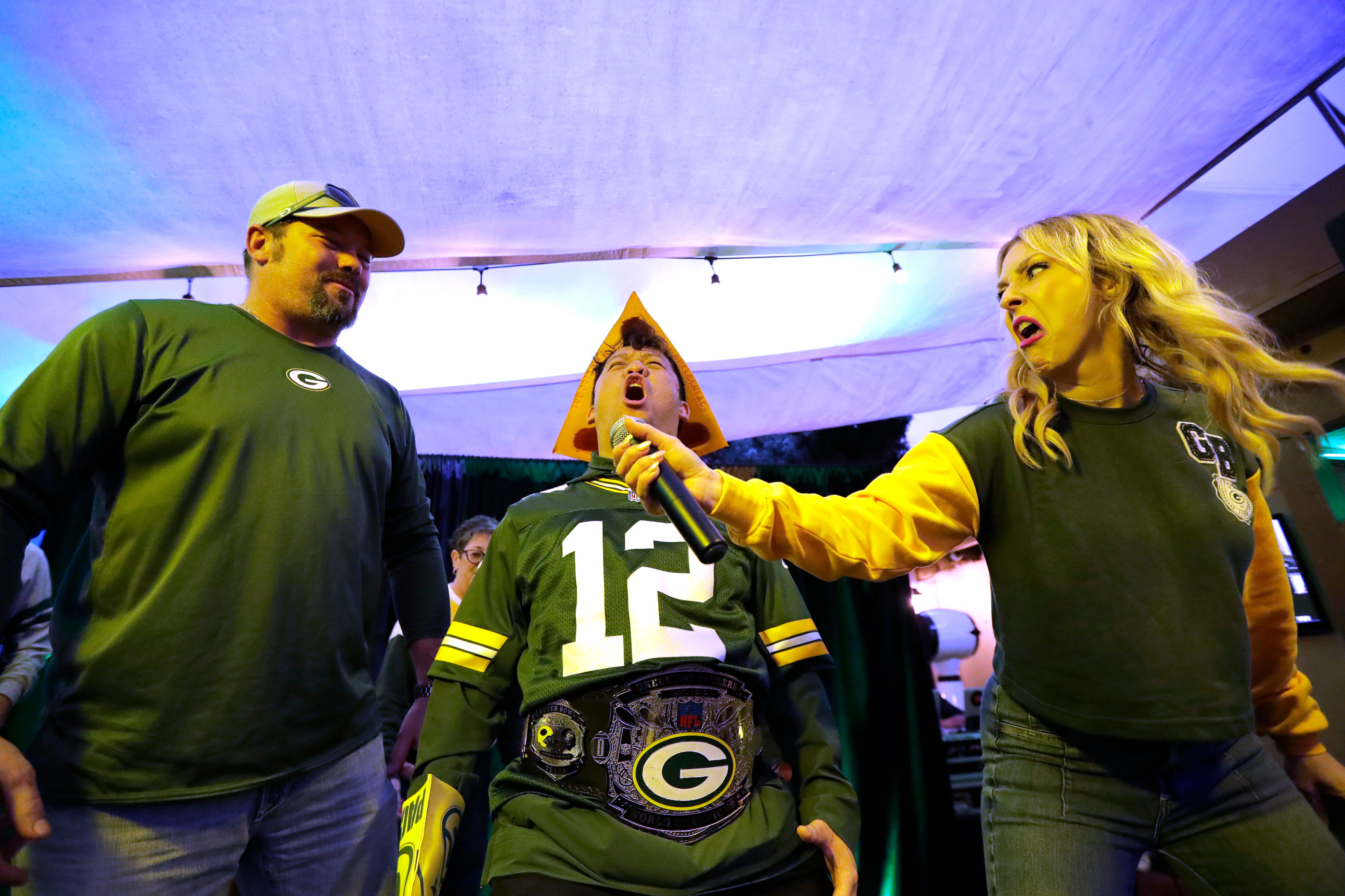 Green Bay Packers fans compete to see who can yell “Go Pack Go” the longest during the Packers Everywhere pep rally Friday, January 19, 2024, at The Patio in Palo Alto, California.