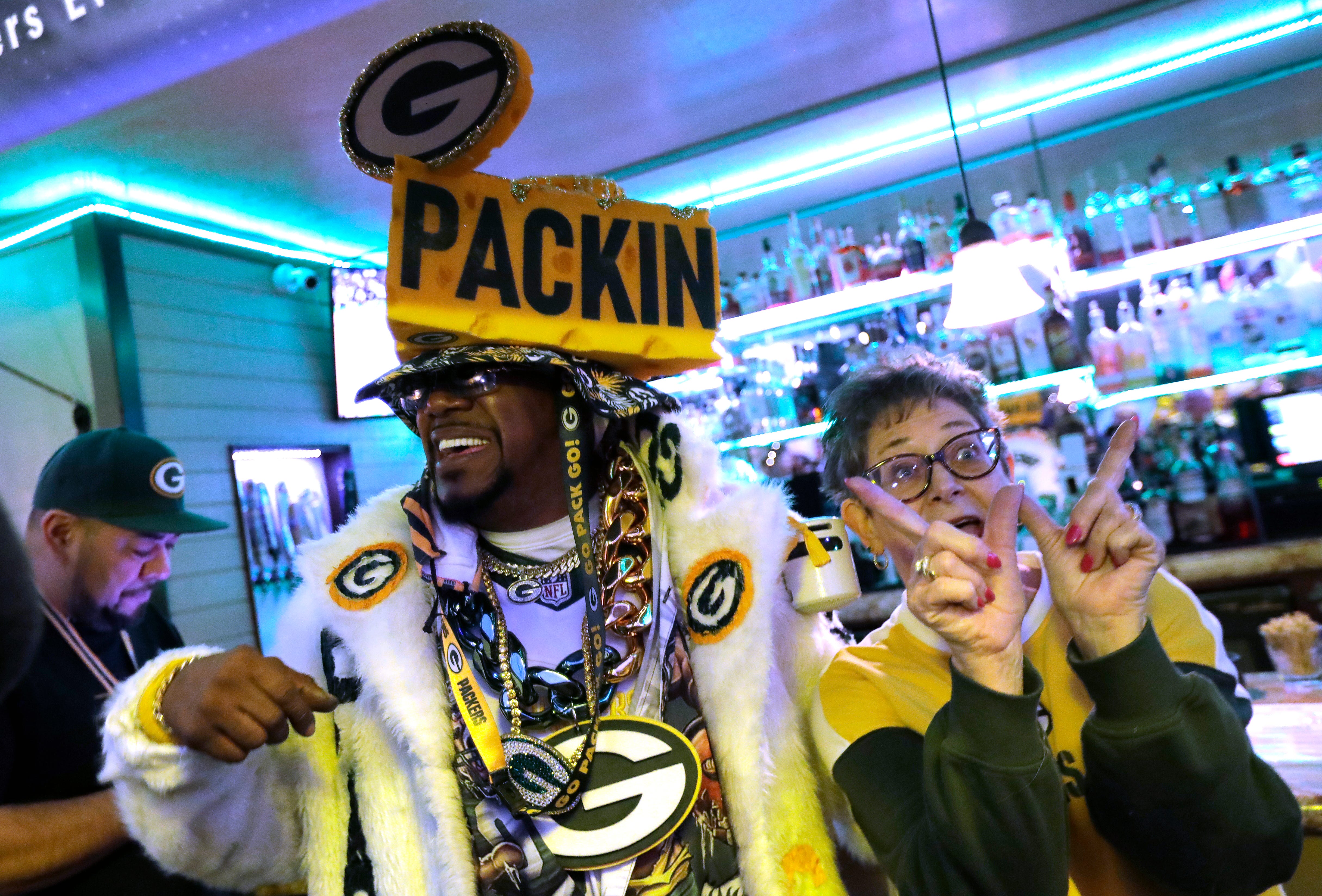 Green Bay Packers fans Anthony Leonard, left, and Laurie Kopp of La Crosse, Wisconsin hang out during the Packers Everywhere pep rally Friday, January 19, 2024, at The Patio in Palo Alto, California.