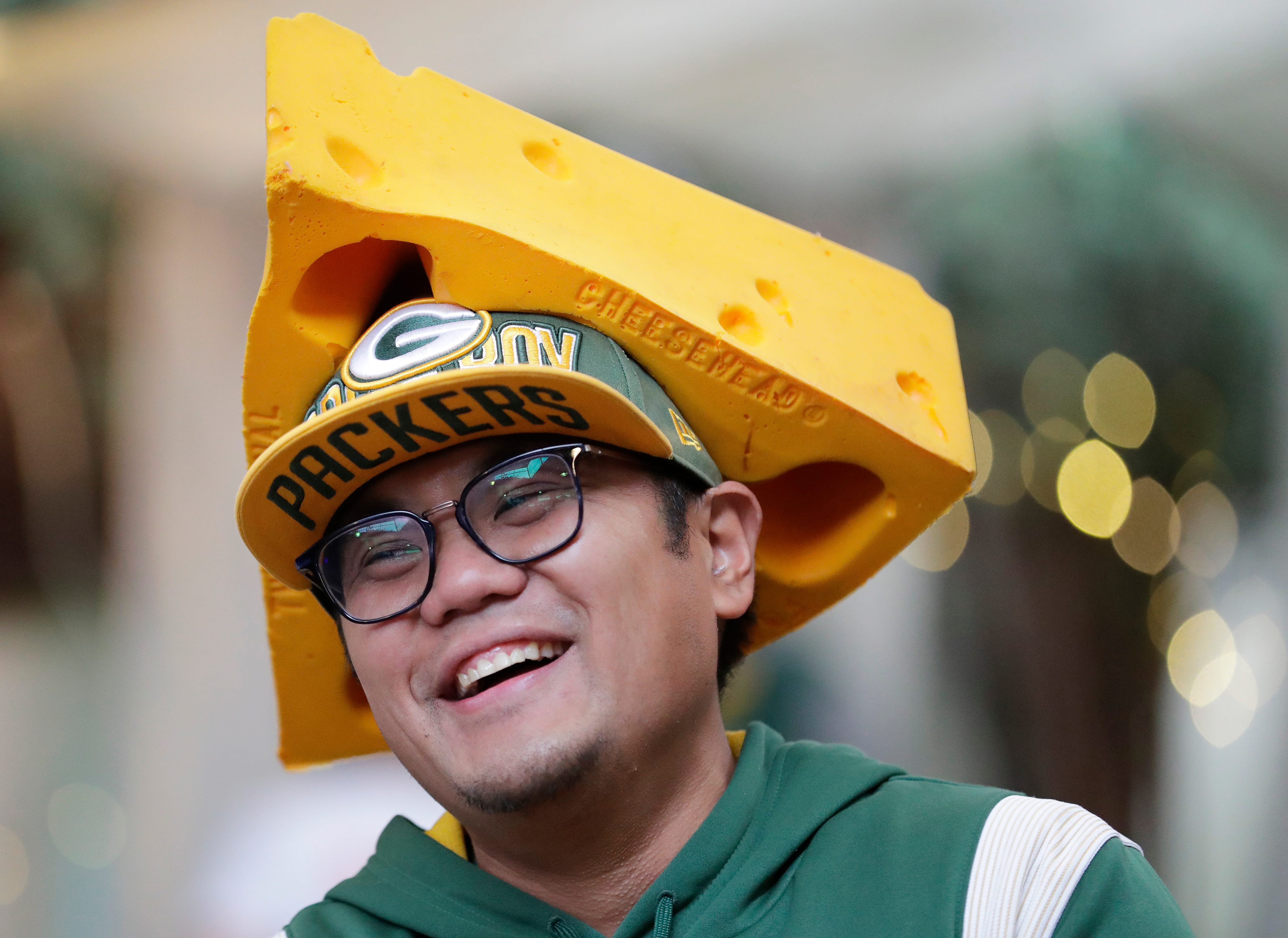 Green Bay Packers fan Danreb Victorio of San Jose shares a laugh with friends during the Packers Everywhere pep rally Friday, January 19, 2024, at The Patio in Palo Alto, California.
