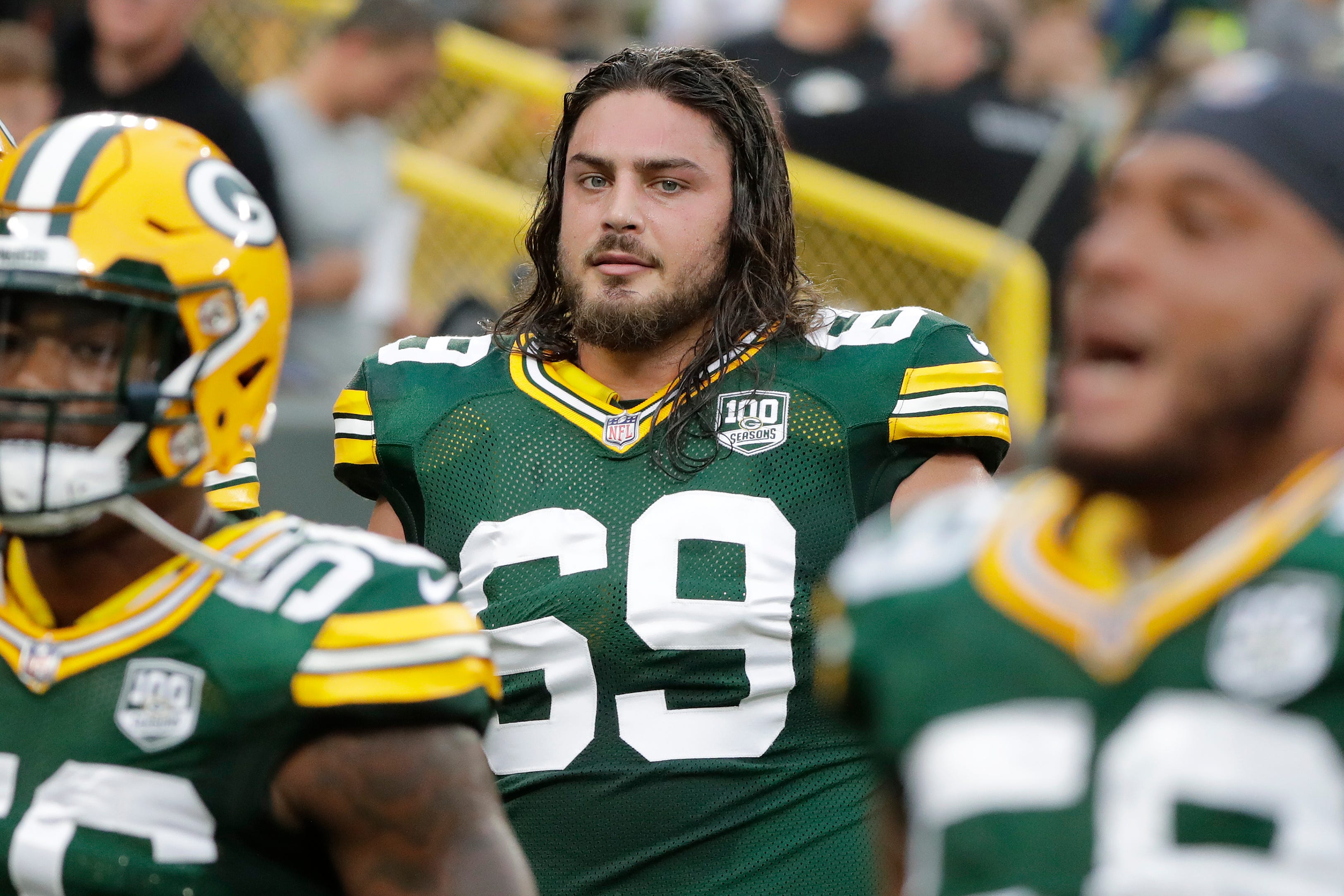 Green Bay Packers offensive tackle David Bakhtiari (69) walks off the field after warmups before an NFL preseason game at Lambeau Field on Thursday, August 16, 2018 in Green Bay, Wis.