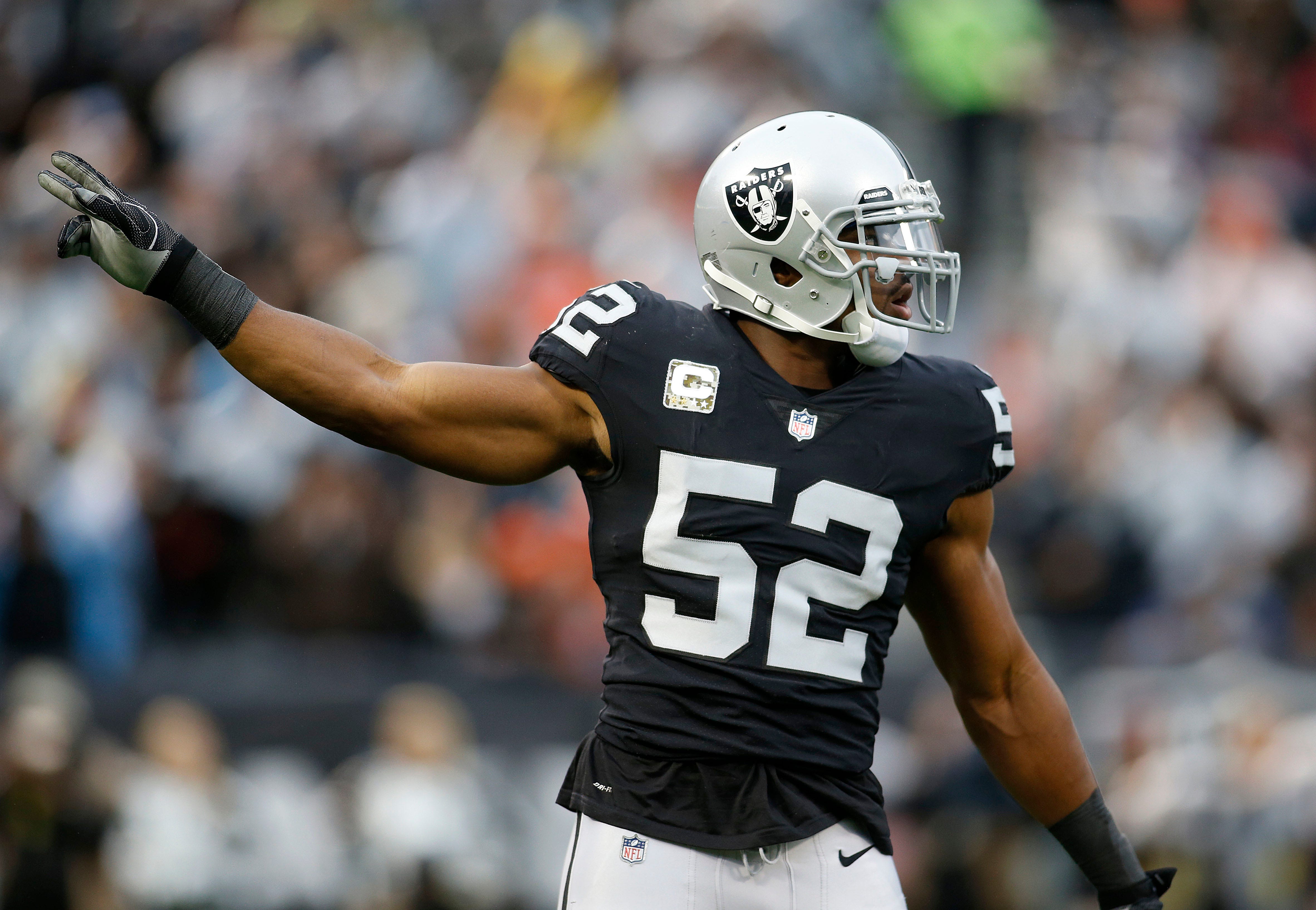 Oakland Raiders defensive end Khalil Mack (52) gestures during the first half of an NFL football game against the Denver Broncos in Oakland, Calif., Sunday, Nov. 26, 2017. (AP Photo/D. Ross Cameron)
