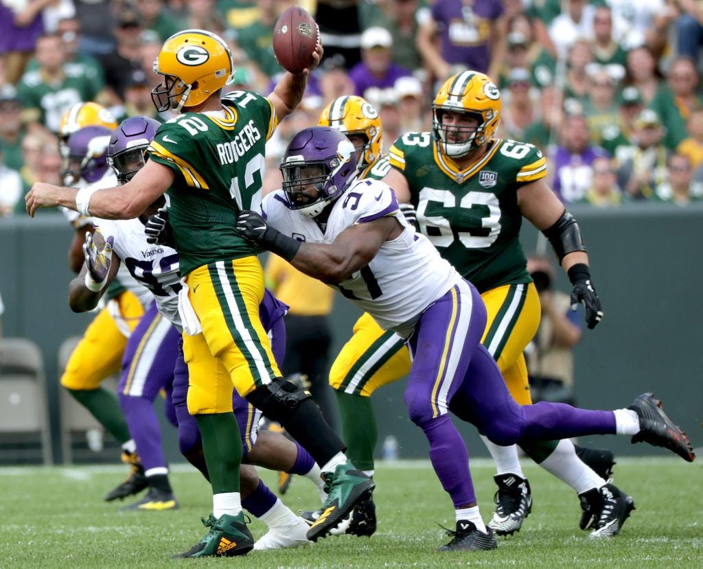 Green Bay Packers quarterback Aaron Rodgers is pressured in the fourth qaurter by Minnesota Vikings defensive end Everson Griffen during their football game on Sunday, September 16, 2018, at Lambeau Field in Green Bay, Wis. The game ended in a 29 to 29 tie.