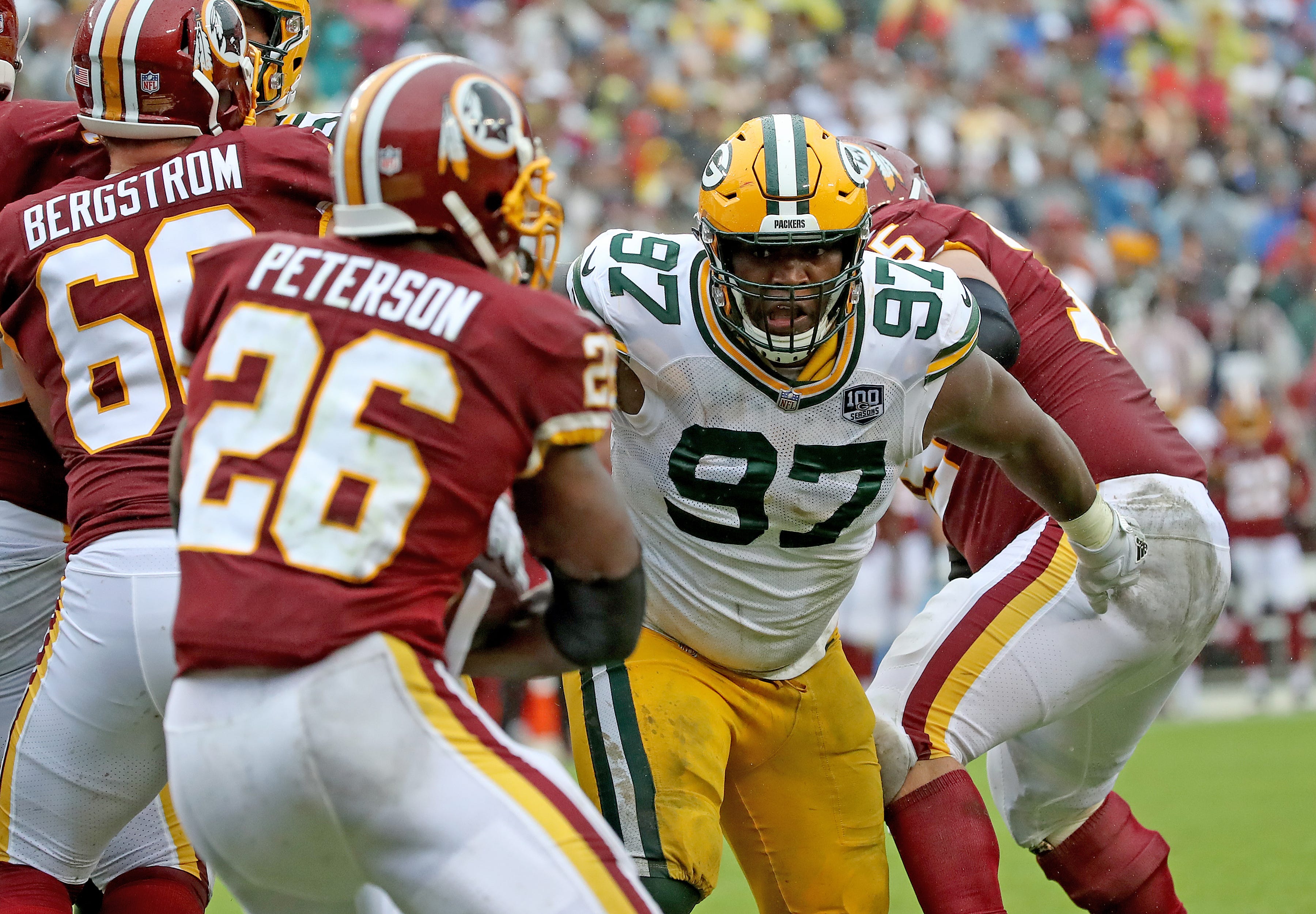 Green Bay Packers nose tackle Kenny Clark (97) breaks into the back field against Washington Sunday, September 23, 2018 at FedEx Field in Landover, MD.