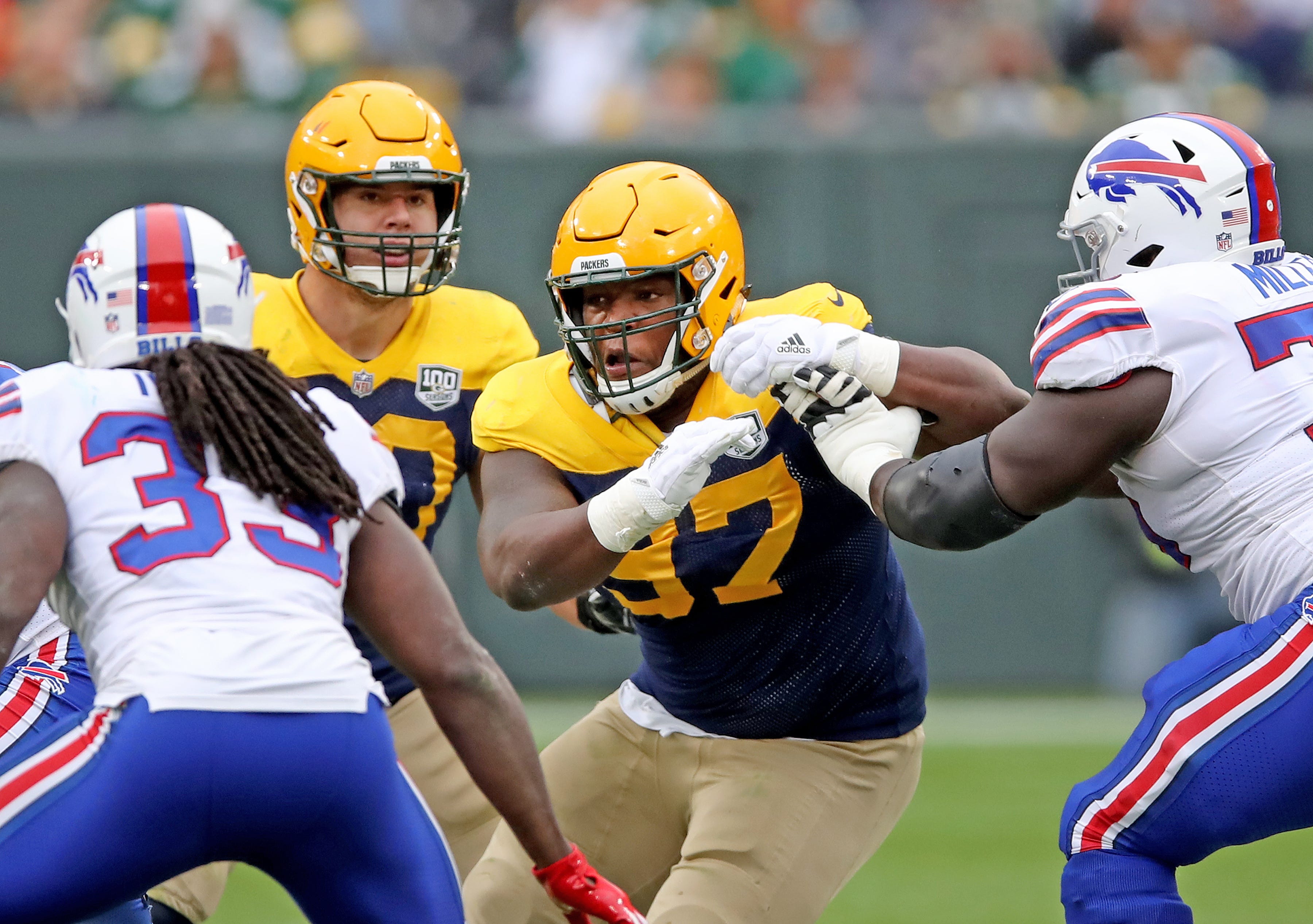 Green Bay Packers nose tackle Kenny Clark (97) rushes against the Buffalo Bills Sunday September 30, 2018 at Lambeau Field in Green Bay, Wis.