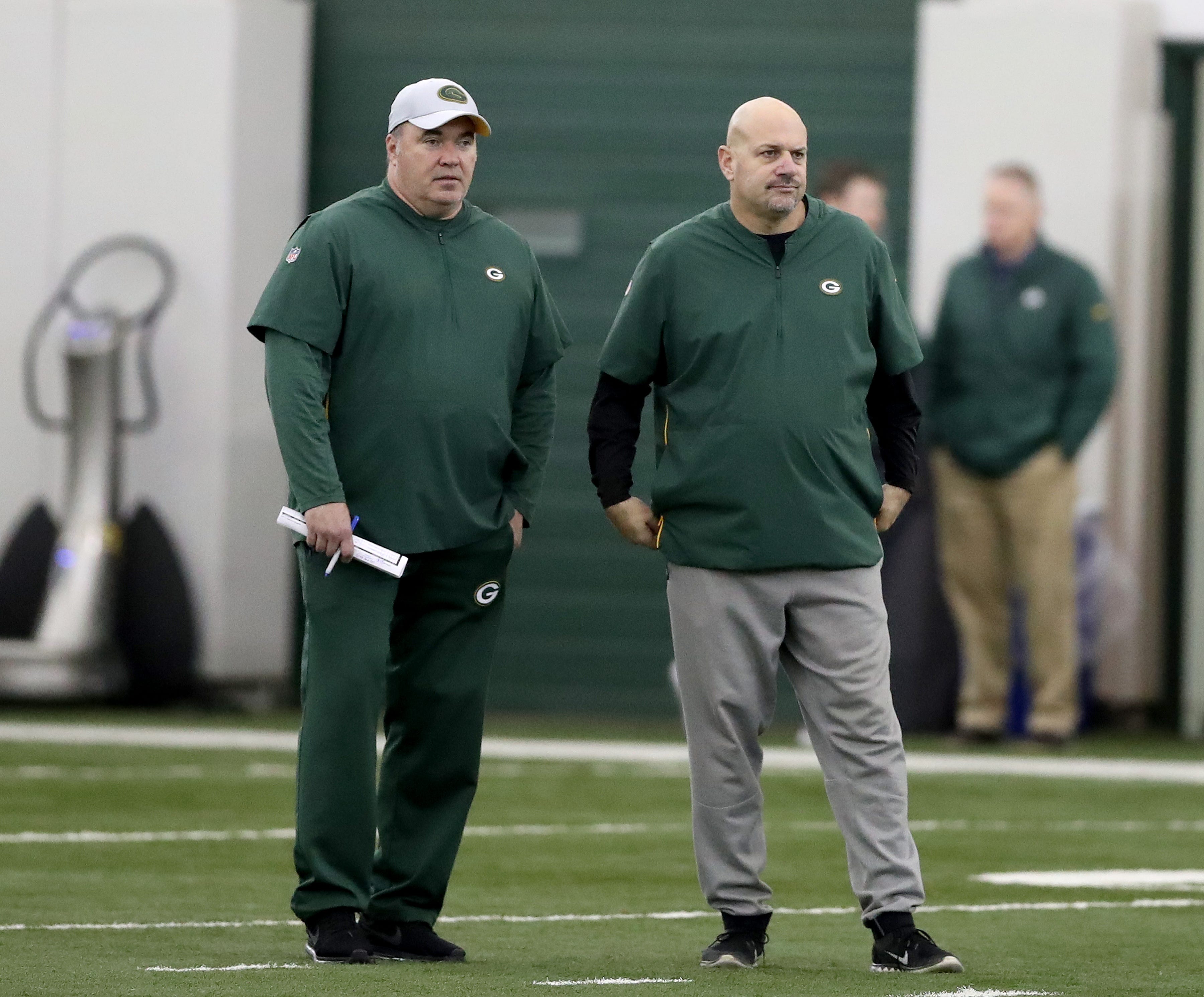 Now former Green Bay Packers head coach Mike McCarthy looks on with defensive coordinator Mike Pettine during practice inside the Hutson Center on Thursday, October 11, 2018 in Ashwaubenon, Wis.