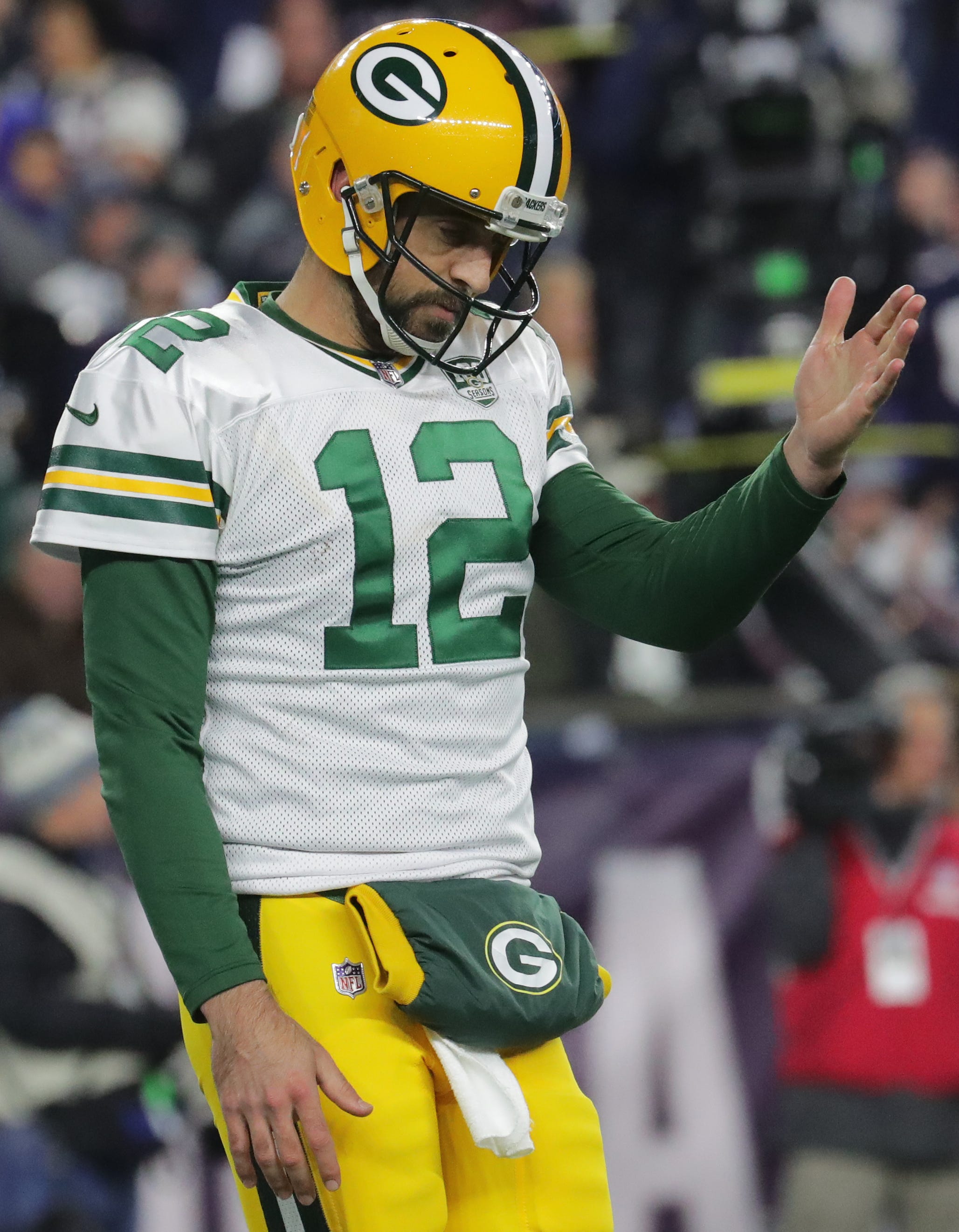 Packers quarterback Aaron Rodgers isn't happy as he walks off the field after the offense failed to convert a third down against the Patriots during the third quarter on Sunday night.