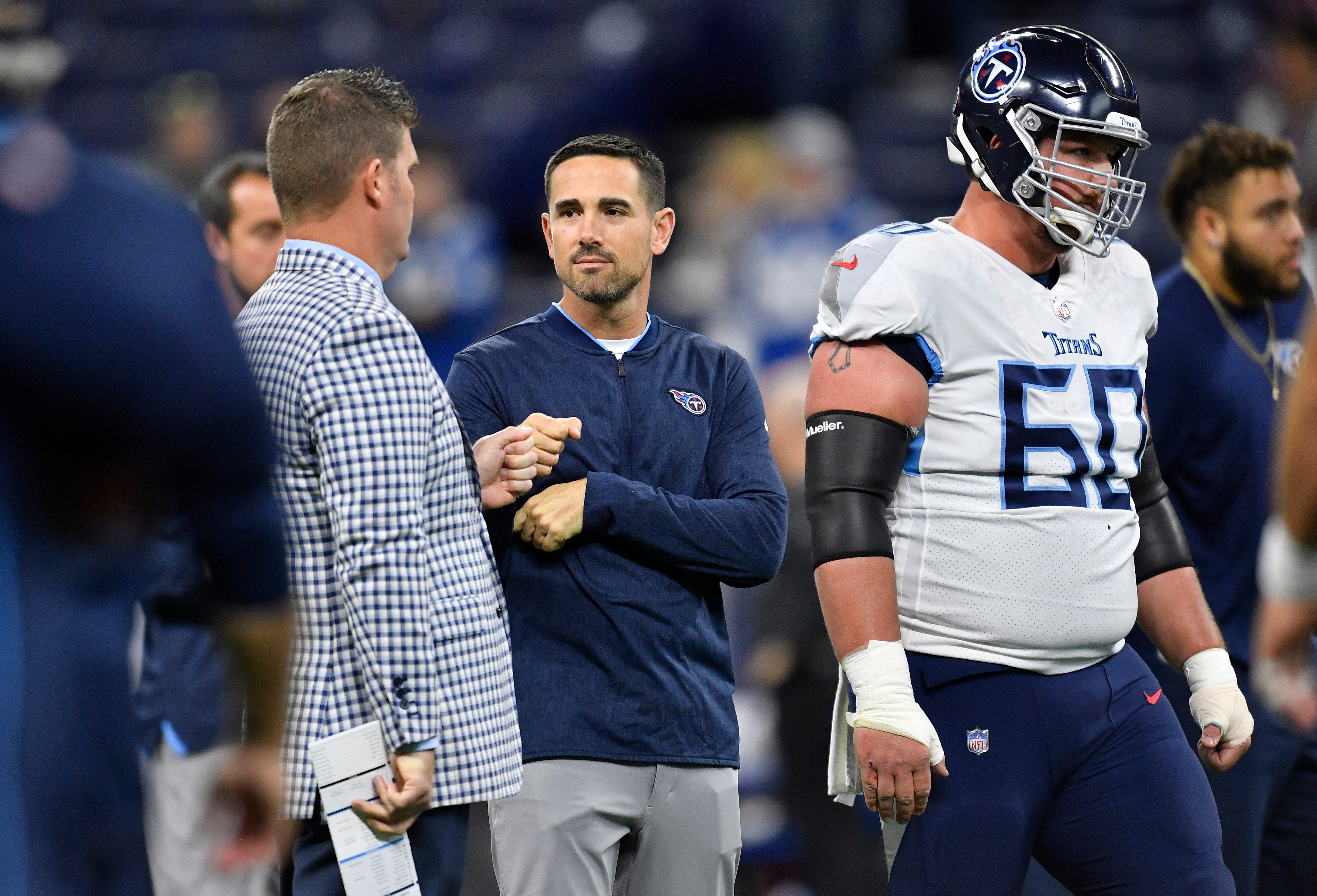 Titans general manager Jon Robinson chats with offensive coordinator Matt Lafleur at Lucas Oil Stadium Sunday, Nov. 18, 2018, in Indianapolis, Ind.