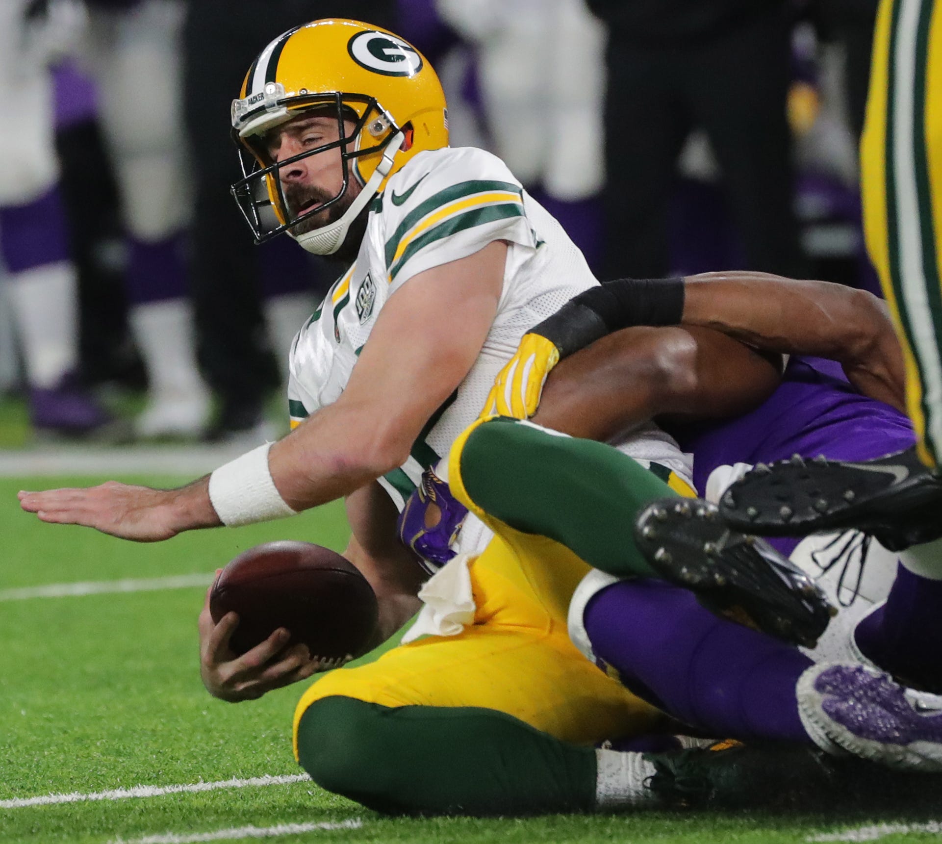 Green Bay Packers quarterback Aaron Rodgers (12) is sacked during the second quarter of their game against the Minnesota Vikings Sunday, November 25, 2018 at U.S. Bank Stadium in Minneapolis, Minn.

MARK HOFFMAN/MHOFFMAN@JOURNALSENTINEL.COM