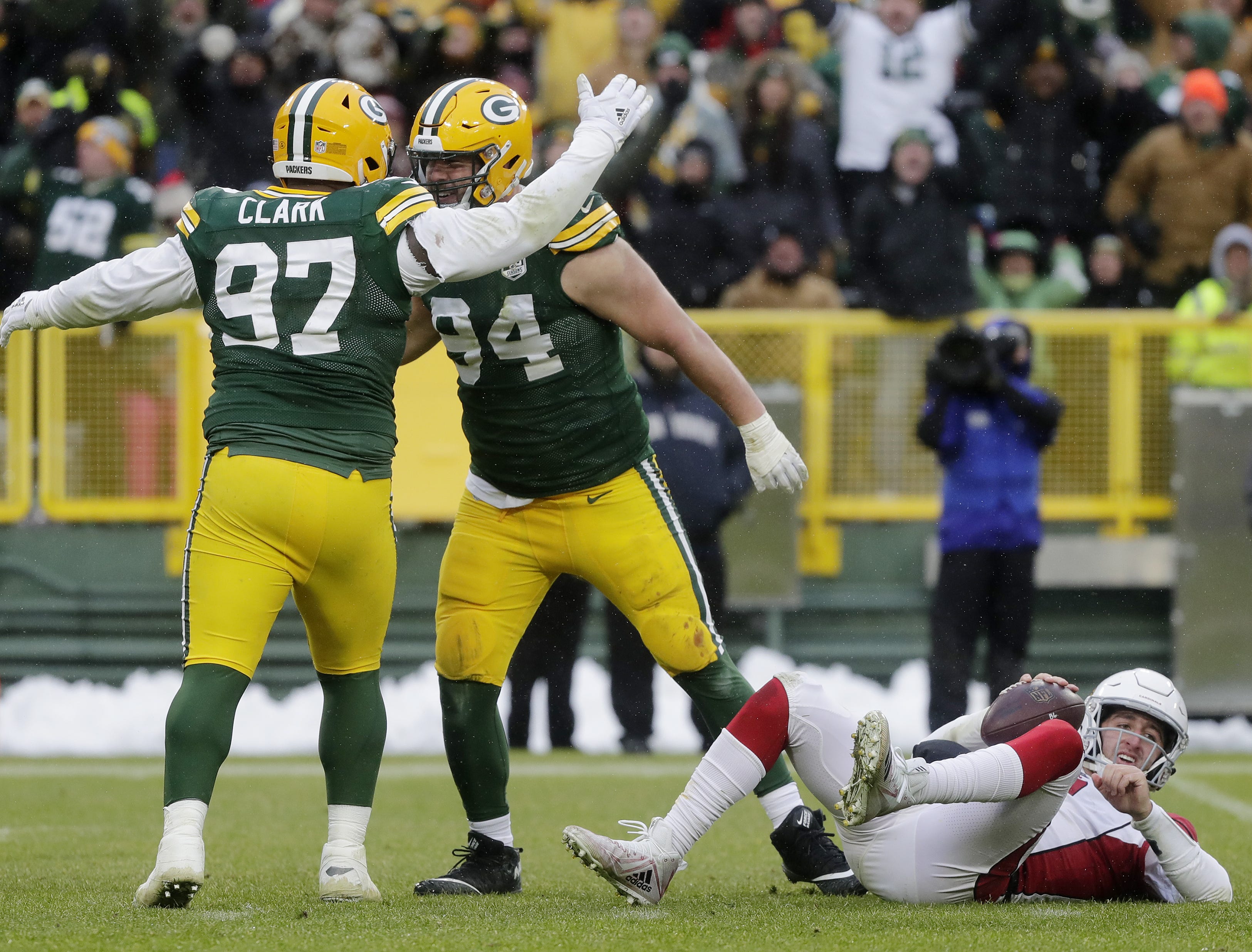 Green Bay Packers defensive end Dean Lowry (94) celebrates with nose tackle Kenny Clark (97) after sacking Arizona Cardinals quarterback Josh Rosen (3) in the fourth quarter at Lambeau Field on Sunday, December 2, 2018 in Green Bay, Wis.