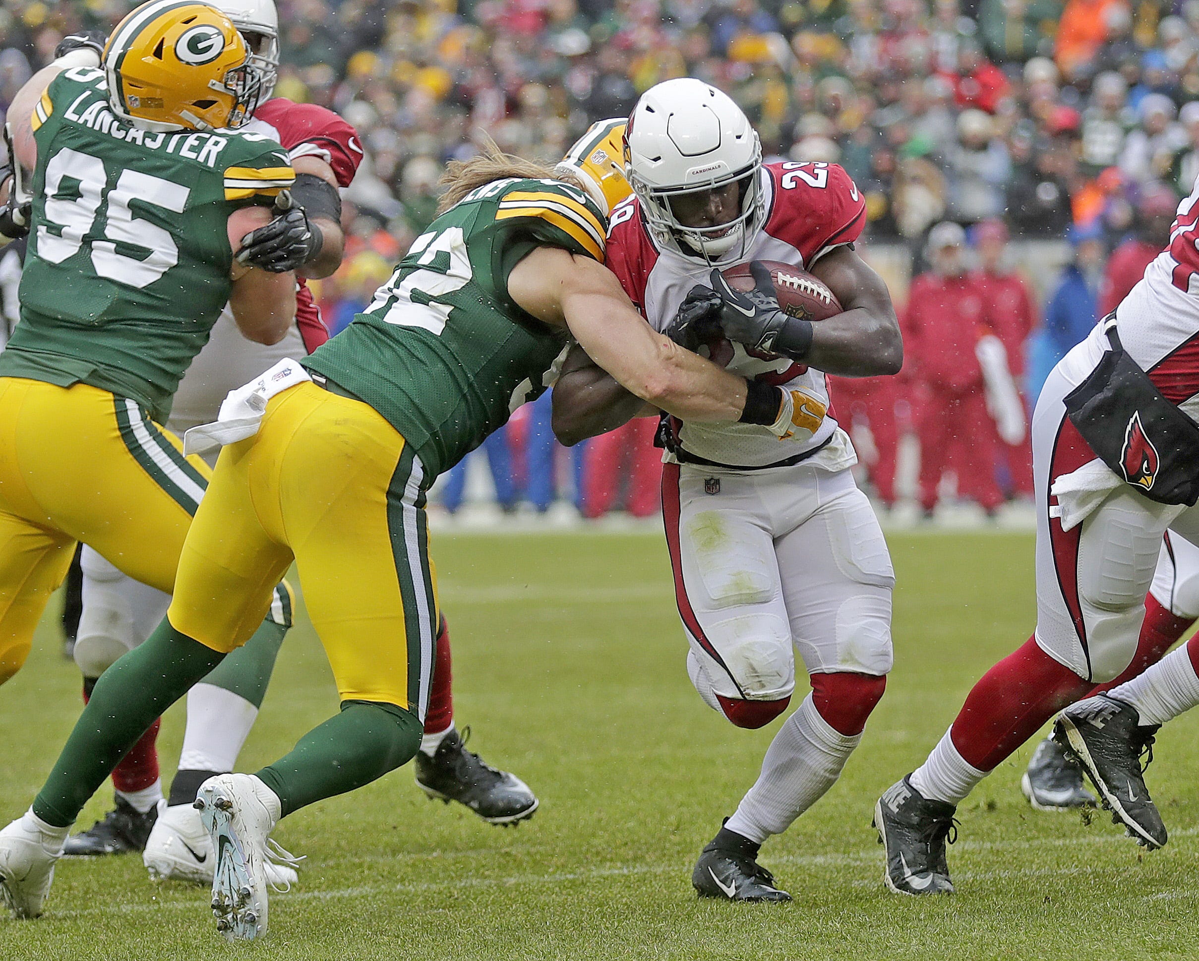 Green Bay Packers outside linebacker Clay Matthews (52) hits but can't stop running back Chase Edmonds (29) from scoring a touchdown in the second quarter against the Arizona Cardinals Sunday, December 2, 2018 at Lambeau Field in Green Bay, Wis.
Jim Matthews/USA TODAY NETWORK-Wis