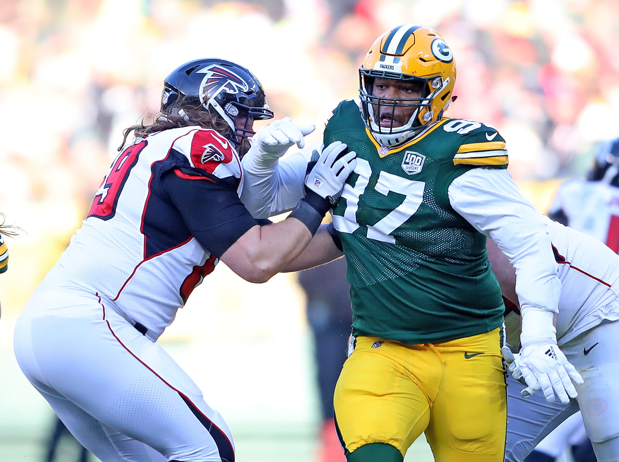 Green Bay Packers nose tackle Kenny Clark (97) crashes through the defense against the Atlanta Falcons Sunday, December 9, 2018 at Lambeau Field in Green Bay, Wis.