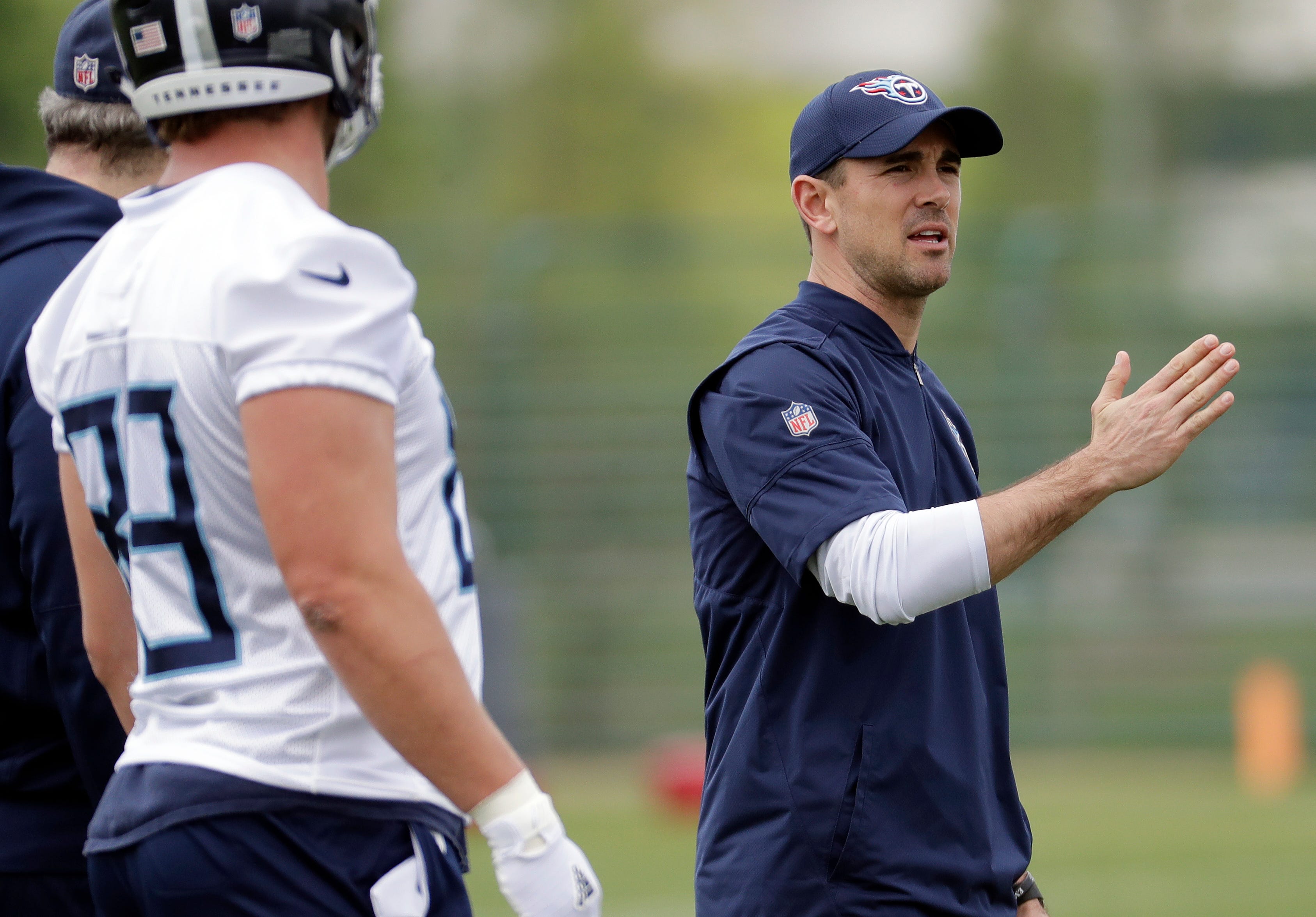 Tennessee Titans new offensive coordinator Matt LaFleur, right, explains a play during a voluntary practice at the team's NFL football training facility Wednesday, April 25, 2018, in Nashville, Tenn. (AP Photo/Mark Humphrey)