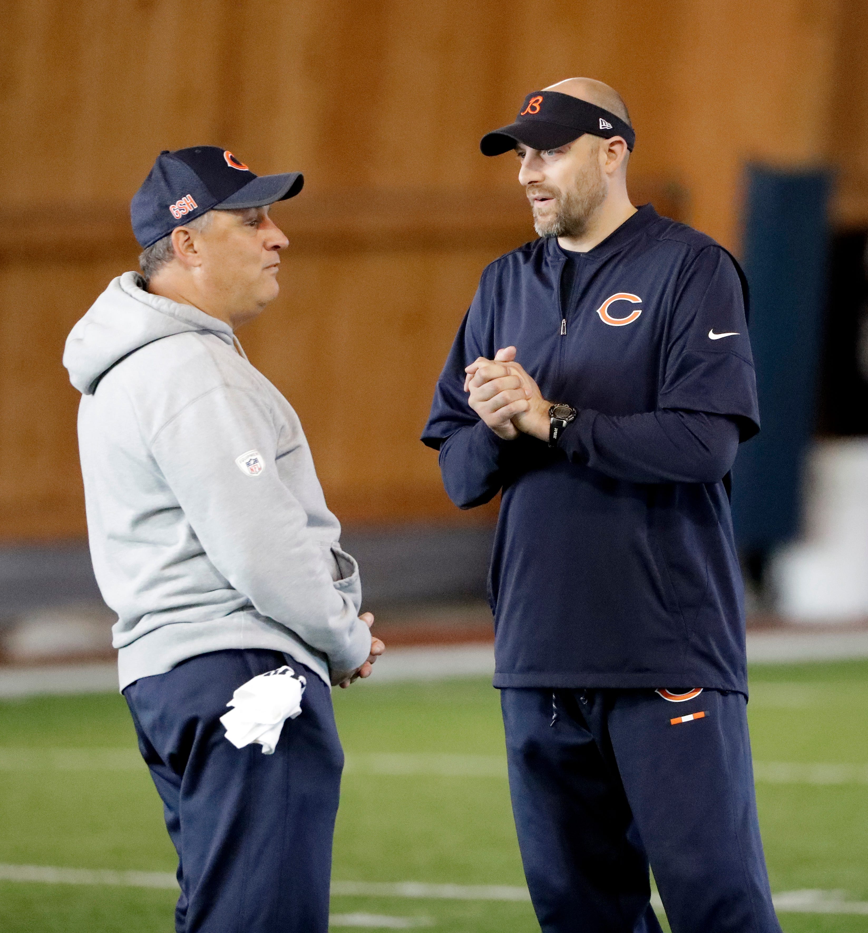 Chicago Bears head coach Matt Nagy, right, listens to defensive coordinator Vic Fangio during the NFL football team's voluntary veteran minicamp Thursday, April 19, 2018, in Lake Forest, Ill. (AP Photo/Nam Y. Huh)