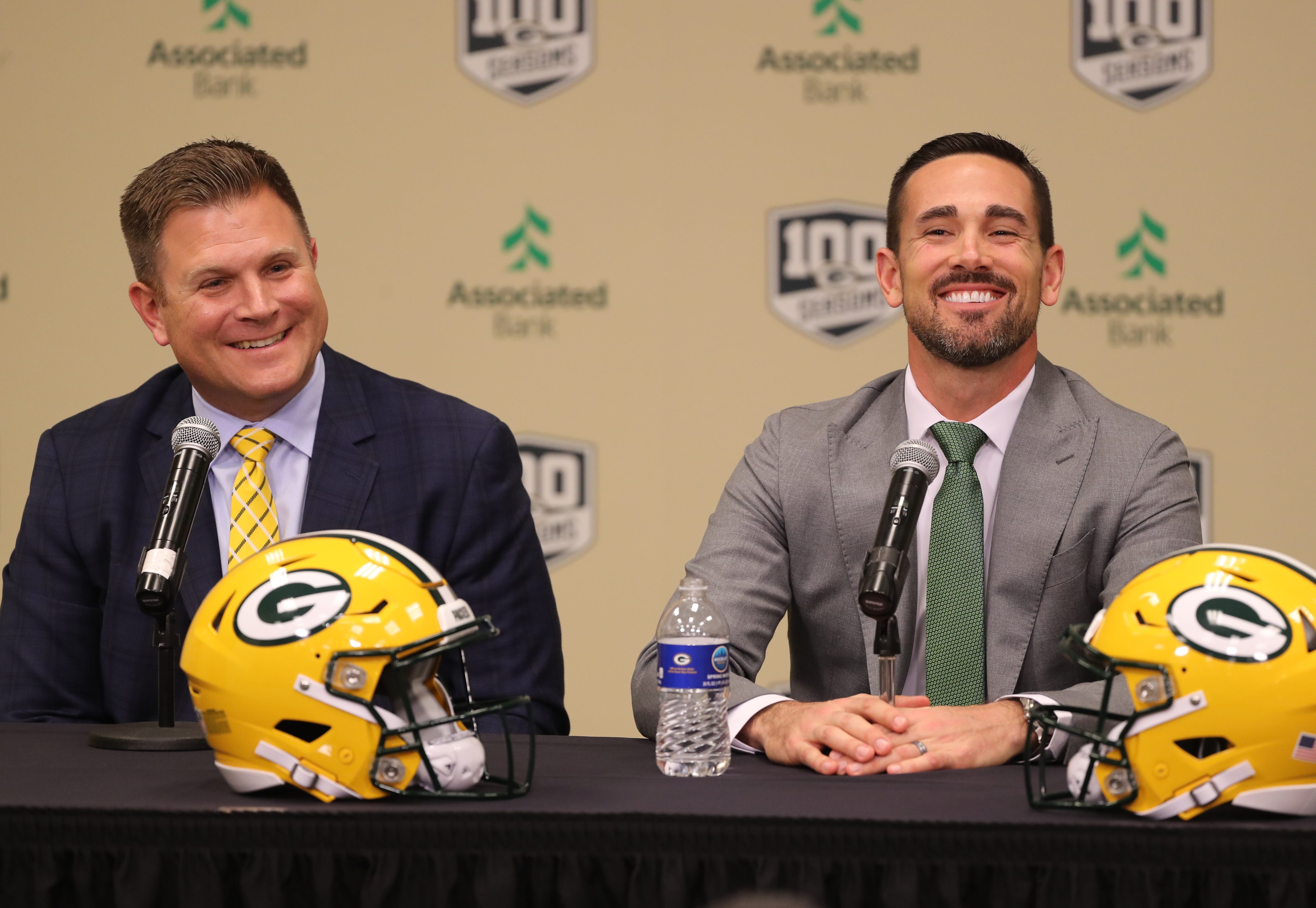 New Green Bay Packers head coach Matt LaFleur, right, laughs with general manager Brian Gutekunst as LaFleur is introduced during a press conference in the Lambeau Field media auditorium Wednesday, January 9, 2019 in Green Bay, Wis.