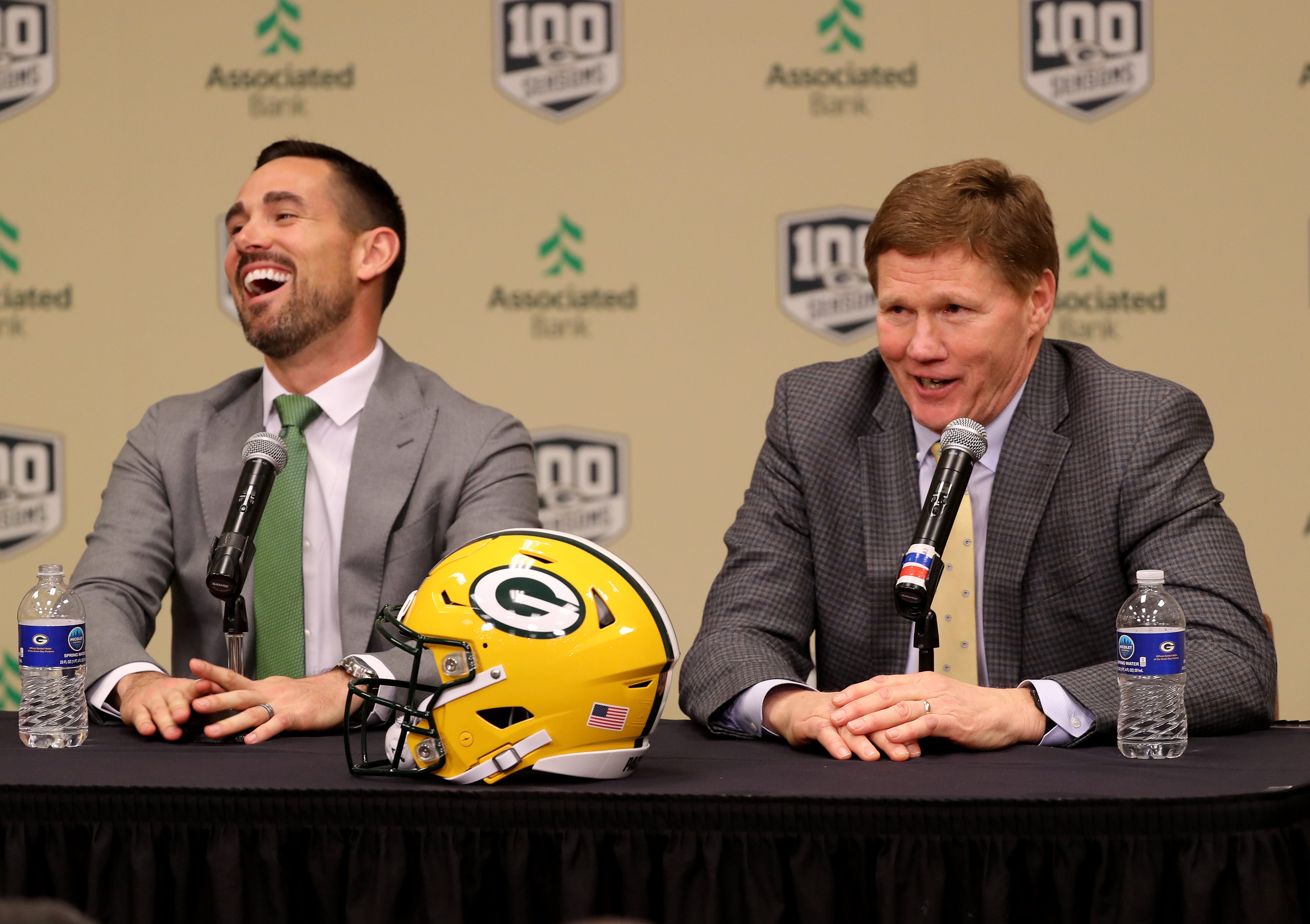 New Green Bay Packers head coach Matt LaFleur laughs as team president Mark Murphy, right, utters an expletive as LaFleur is introduced during a press conference in the Lambeau Field media auditorium Wednesday, January 9, 2019 in Green Bay, Wis.