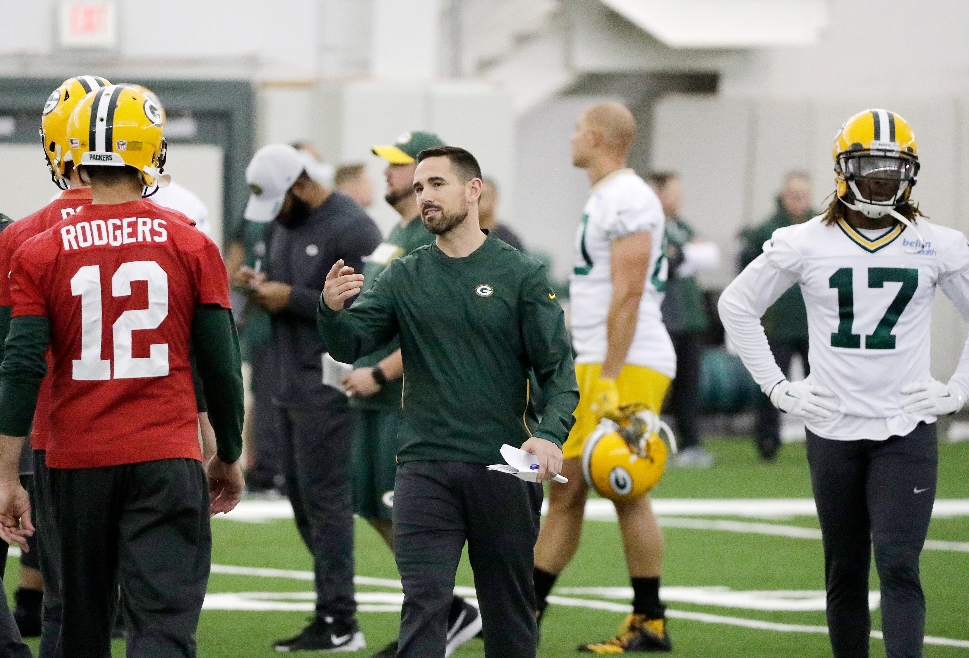 Green Bay Packers head coach Matt LaFleur talks to quarterback Aaron Rodgers (12) during a team practice at the Don Hutson Center on Wednesday, April 24, 2019 in Ashwaubenon, Wis.