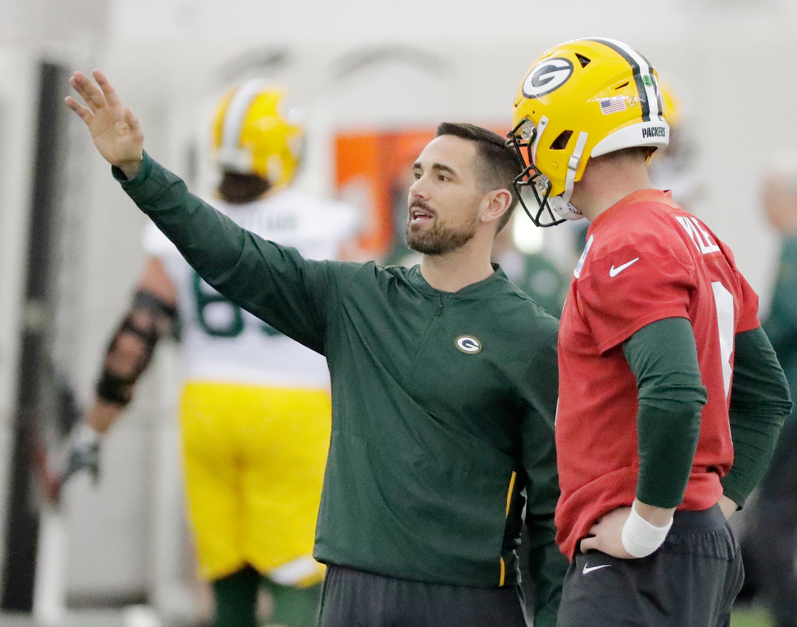 Green Bay Packers head coach Matt LaFleur talks to quarterback Tim Boyle (8) during a team practice at the Don Hutson Center on Wednesday, April 24, 2019 in Ashwaubenon, Wis.