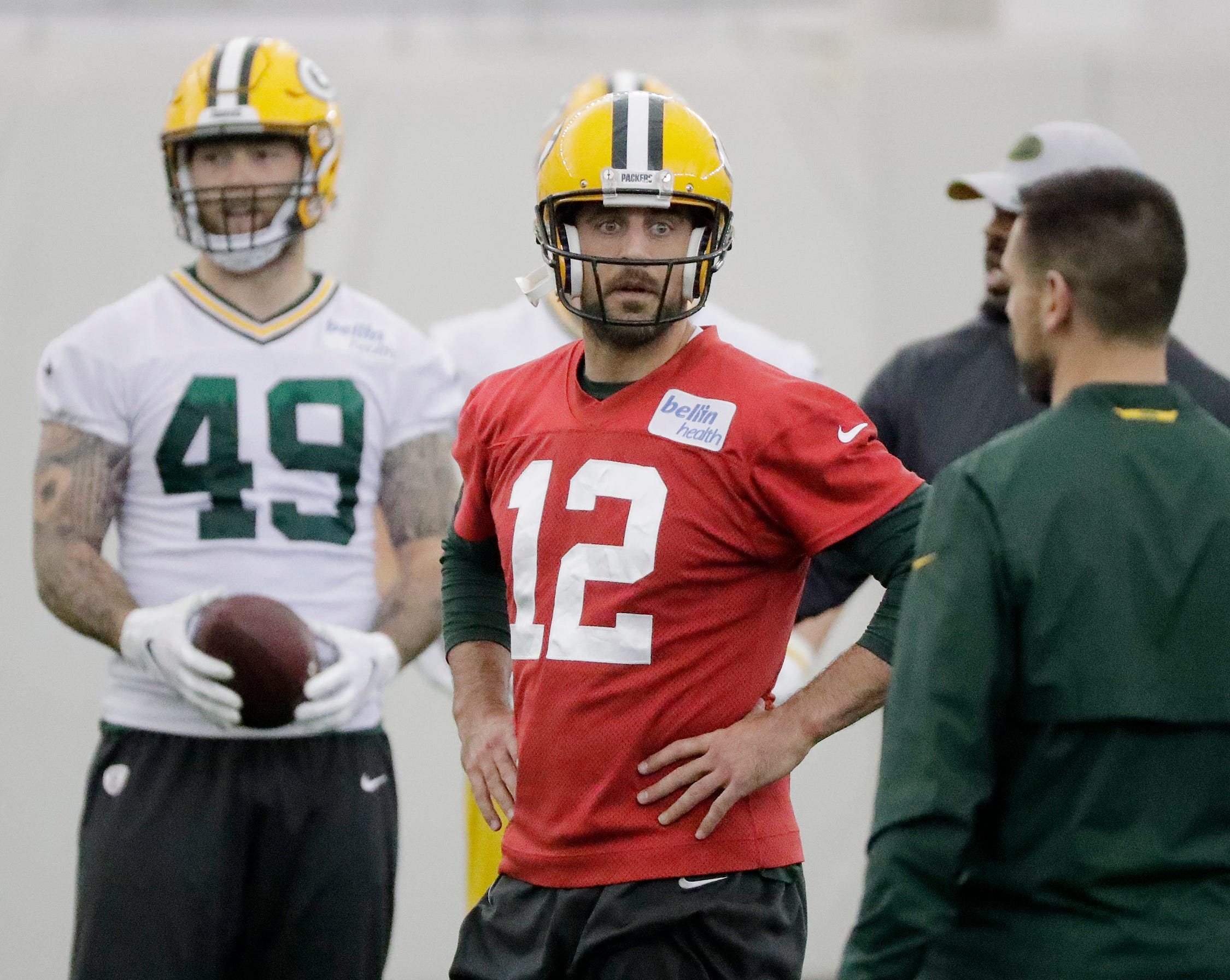 Green Bay Packers quarterback Aaron Rodgers (12) talks to head coach Matt LaFleur during a team practice at the Don Hutson Center on Wednesday, April 24, 2019 in Ashwaubenon, Wis.