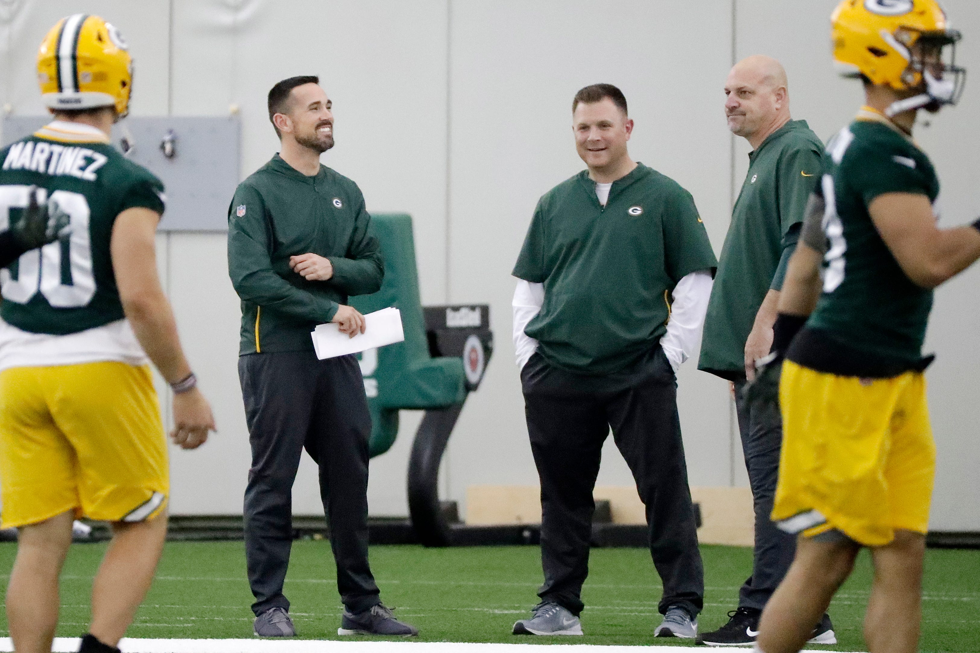 Green Bay Packers head coach Matt LaFleur, general manager Brian Gutekunst, and defensive coordinator Mike Pettine talk during a team practice at the Don Hutson Center on Wednesday, April 24, 2019 in Ashwaubenon, Wis.