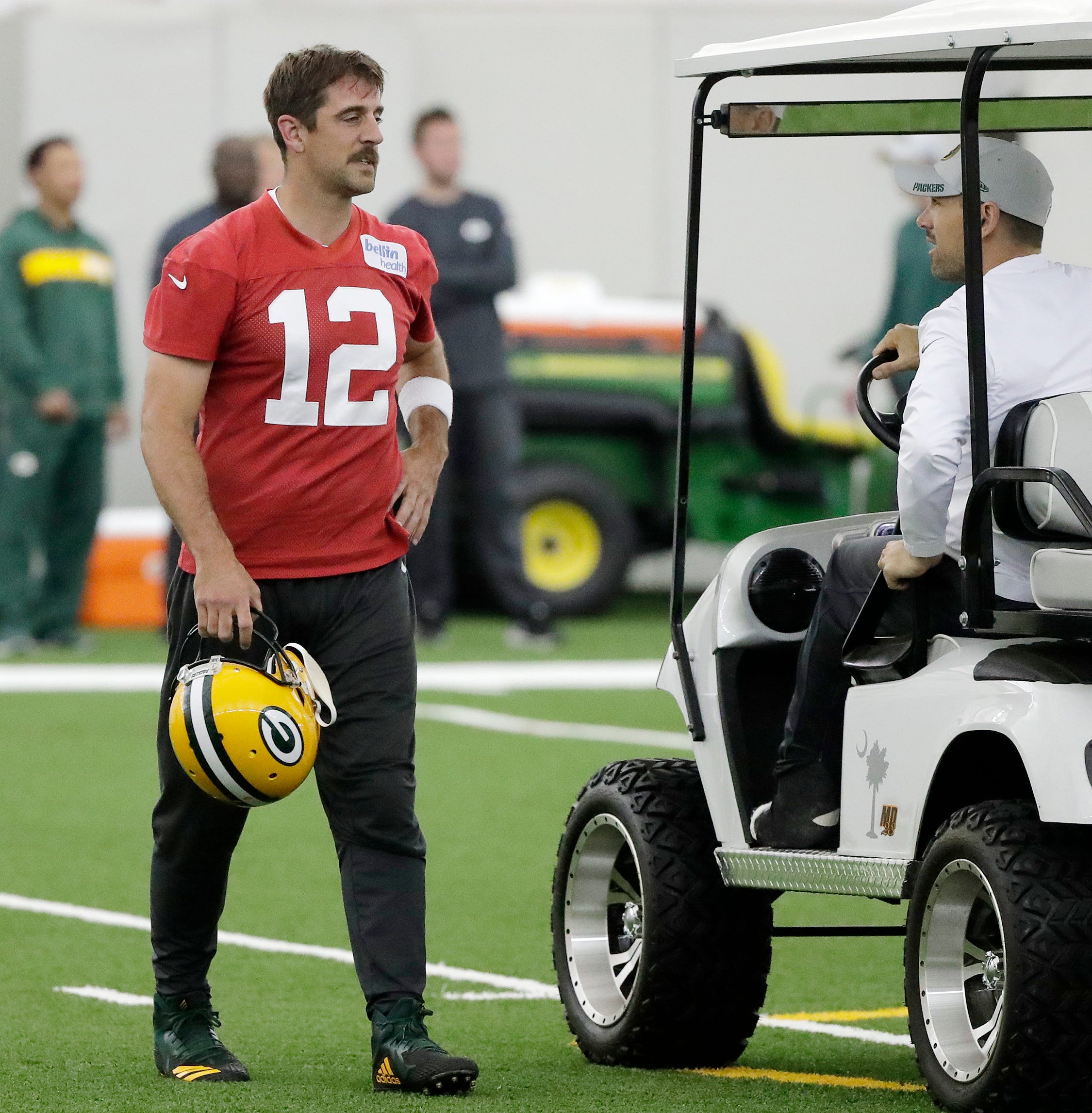 Green Bay Packers quarterback Aaron Rodgers (12) and head coach Matt LaFleur during practice at the Don Hutson Center on Wednesday, June 12, 2019 in Ashwaubenon, Wis.