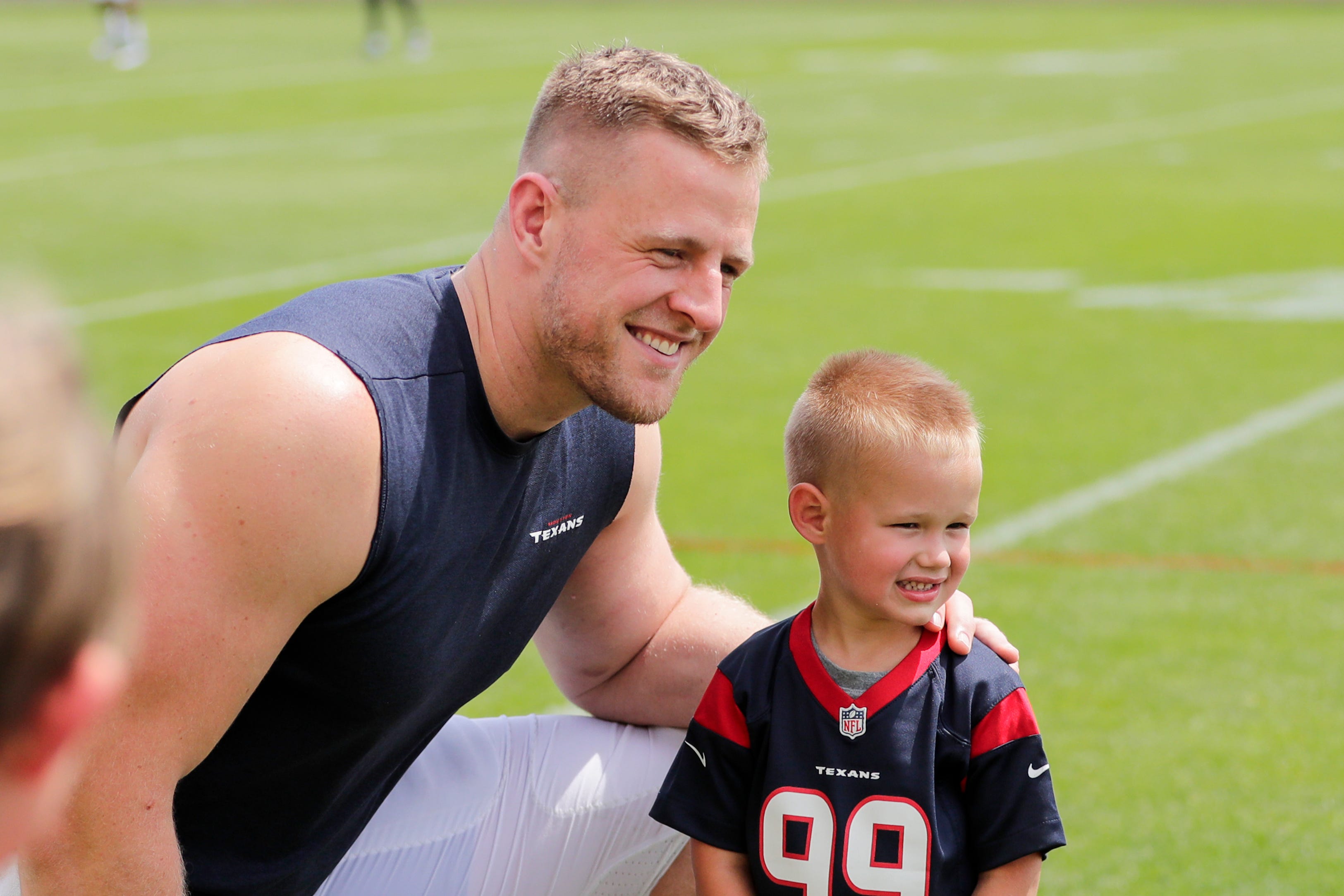 Texans defensive end J. J. Watt (99) greets fans after a joint training camp practice with the Green Bay Packers at Ray Nitchske Field Monday, August 5, 2019, in Ashwaubenon, Wis.
