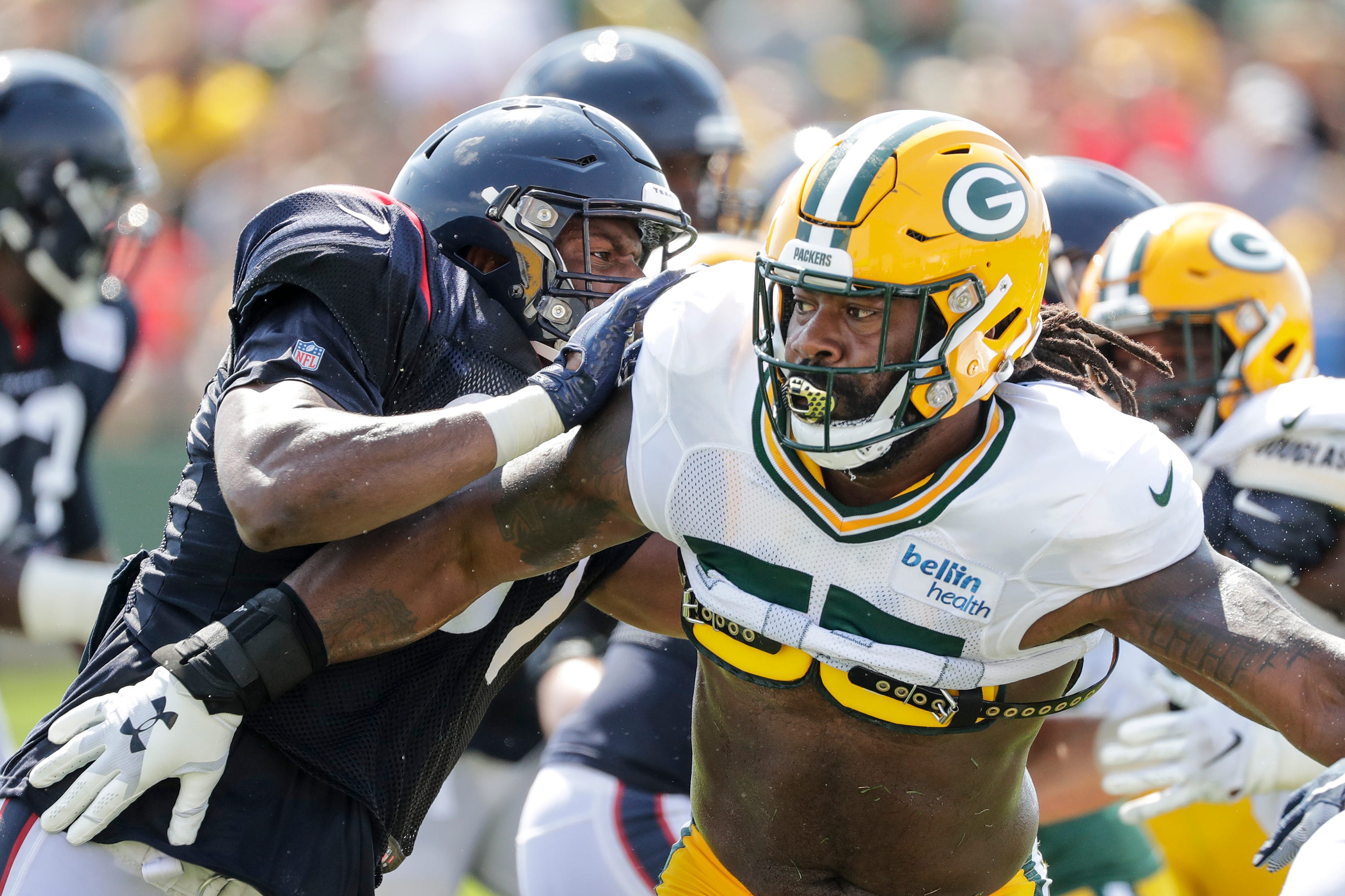 Packers linebacker Za'Darius Smith (55) makes a move past Texans tight end Darren Fells (87) during a joint training camp practice at Ray Nitchske Field Monday, August 5, 2019, in Ashwaubenon, Wis.