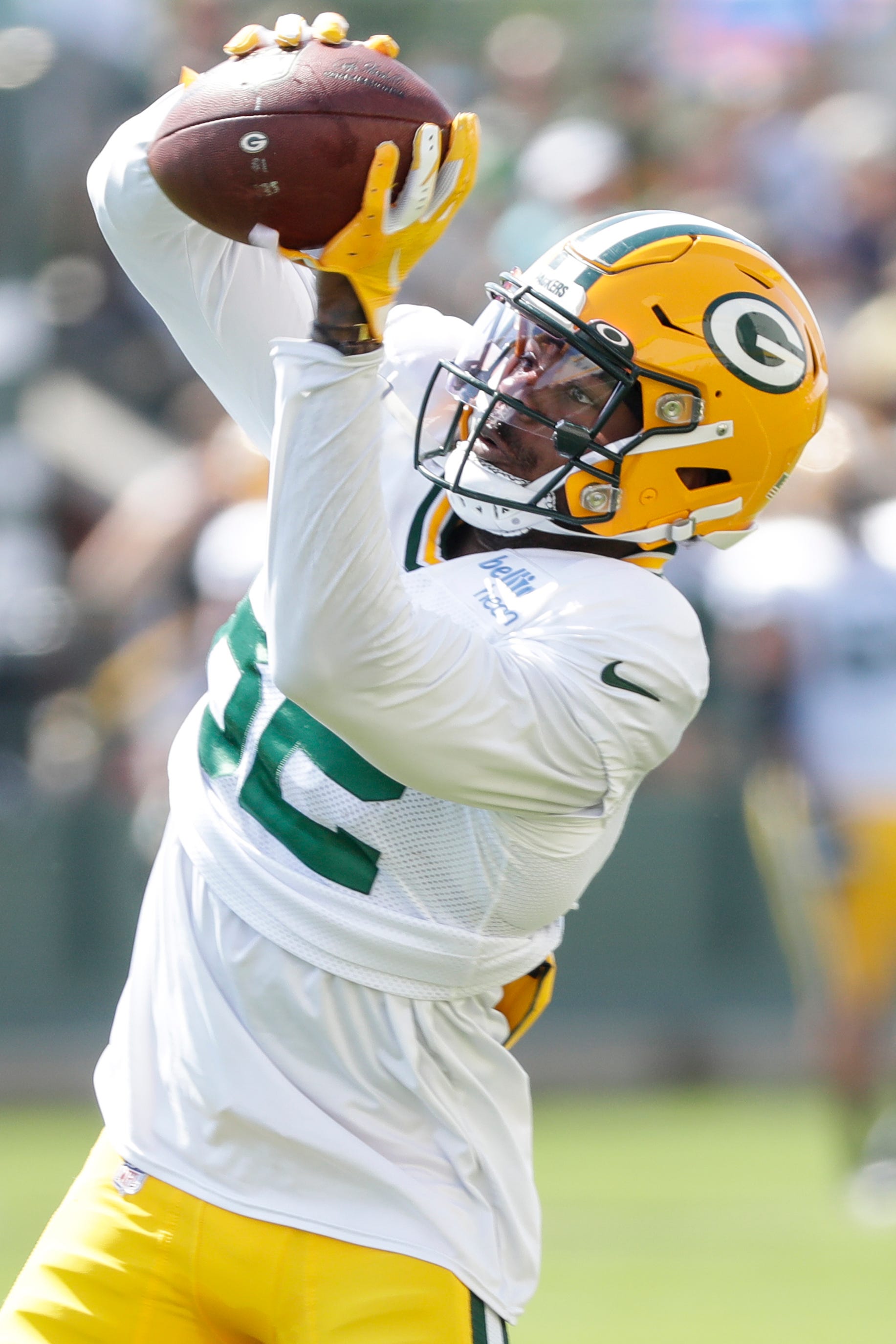 Green Bay wide receiver J'mon Moore (82) catches a pass during a scrimmage at a joint training camp practice with the Texans at Ray Nitchske Field Monday, August 5, 2019, in Ashwaubenon, Wis.