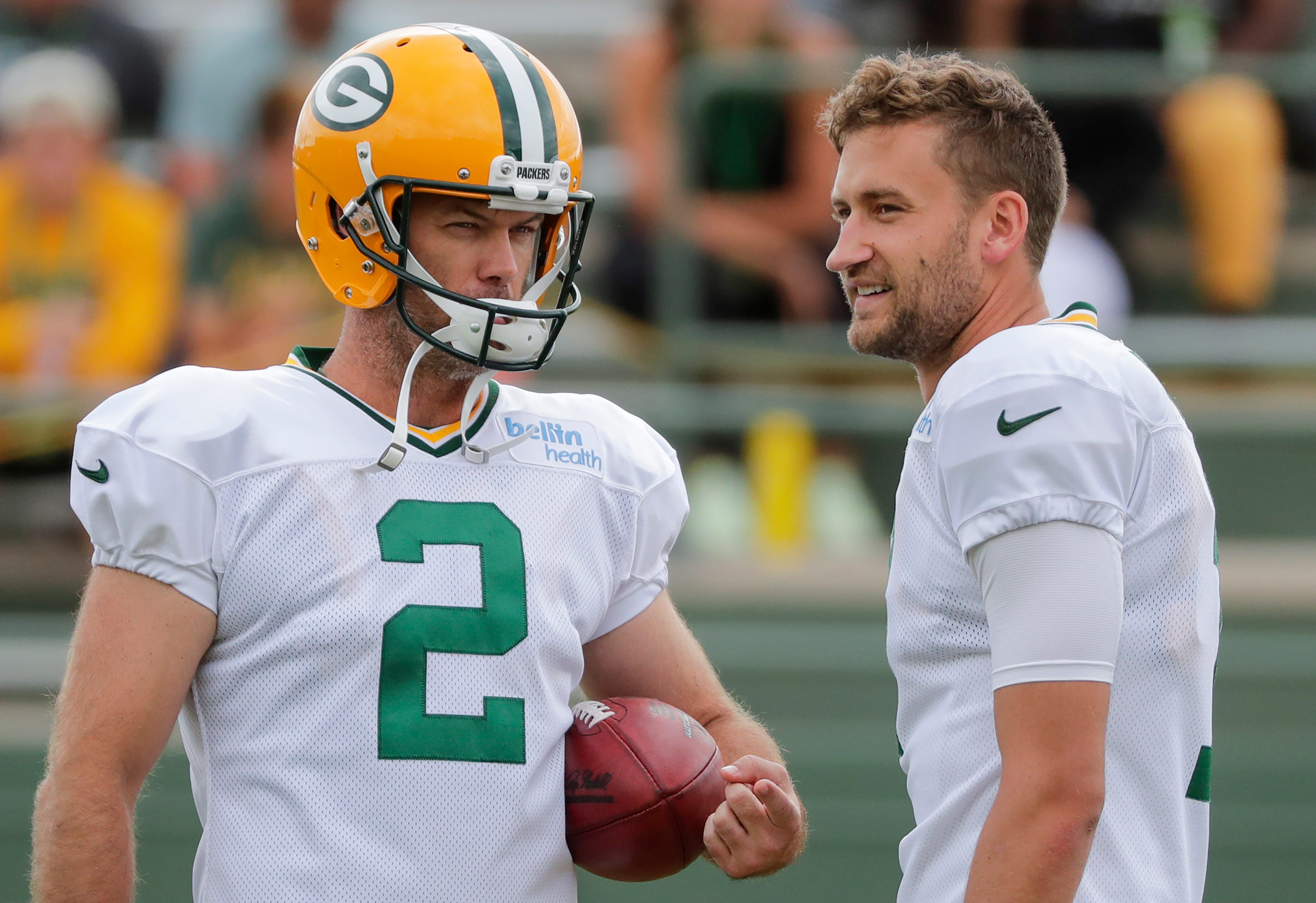 Green Bay Packers' Mason Crosby and Sam Ficken talk during training camp practice Tuesday, August 13, 2019, at Ray Nitschke Field in Ashwaubenon, Wis.