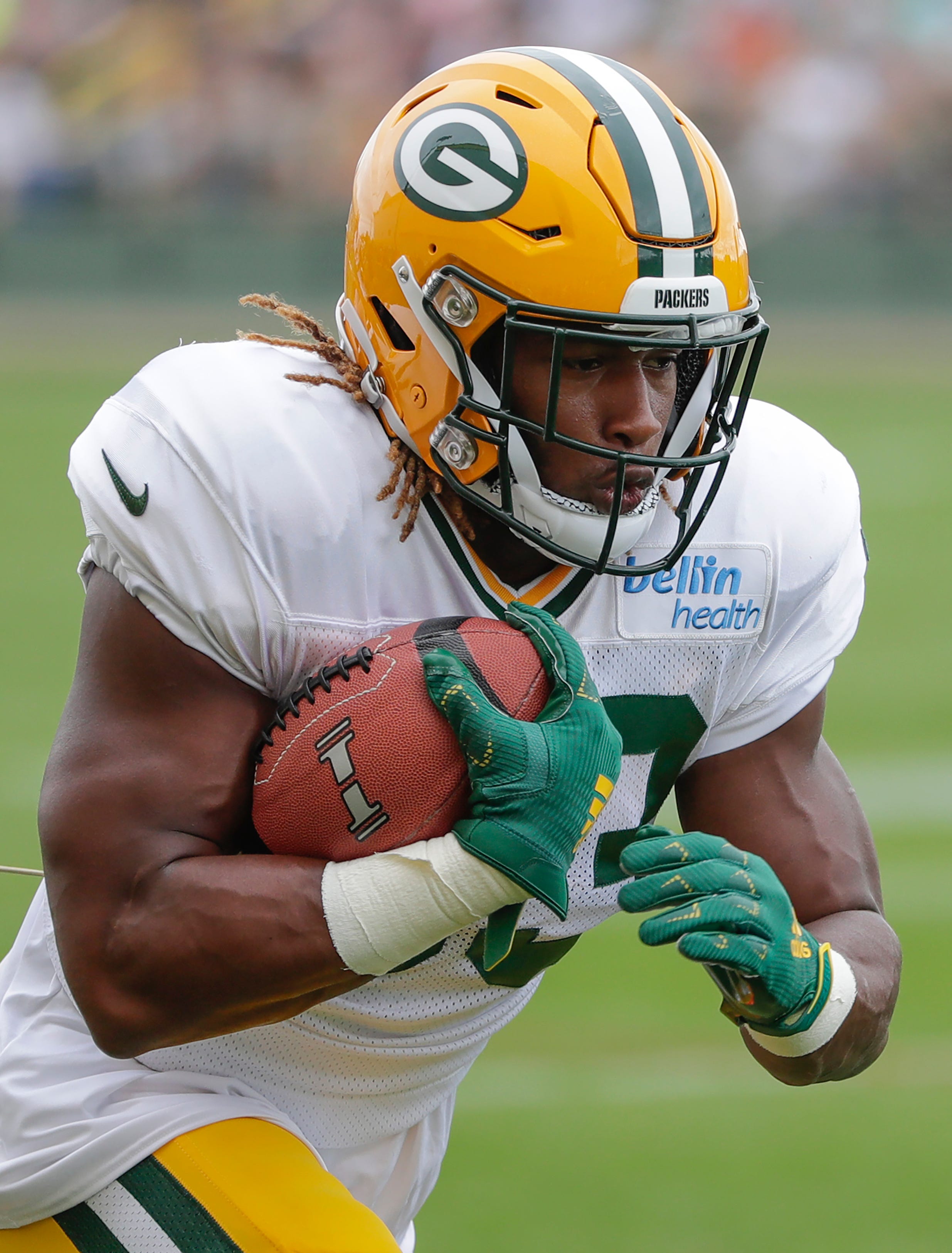 Green Bay Packers' Aaron Jones runs a drill during training camp practice Tuesday, August 13, 2019, at Ray Nitschke Field in Ashwaubenon, Wis.