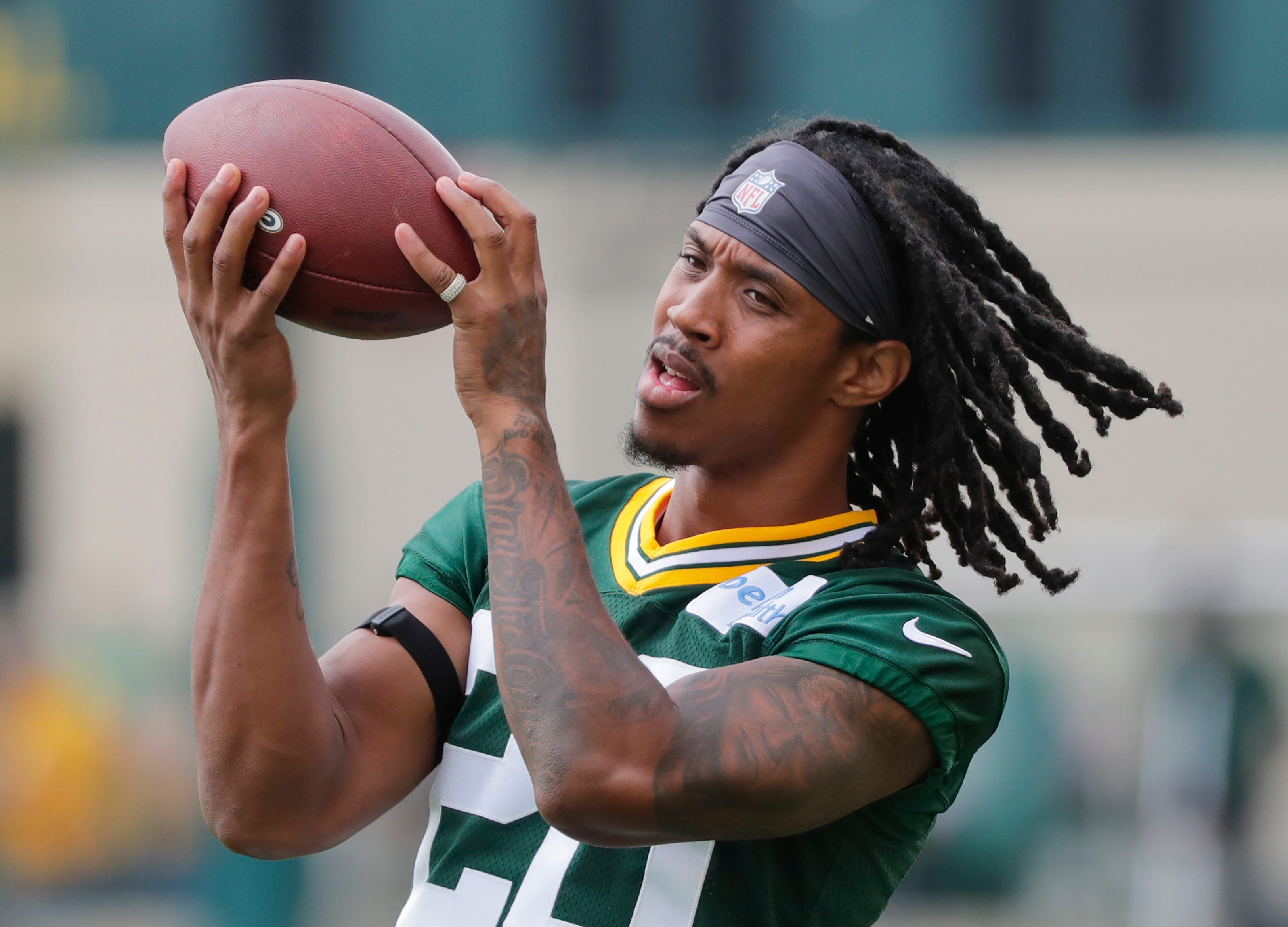 Green Bay Packers' Kevin King warms up during training camp practice Tuesday, August 13, 2019, at Ray Nitschke Field in Ashwaubenon, Wis.