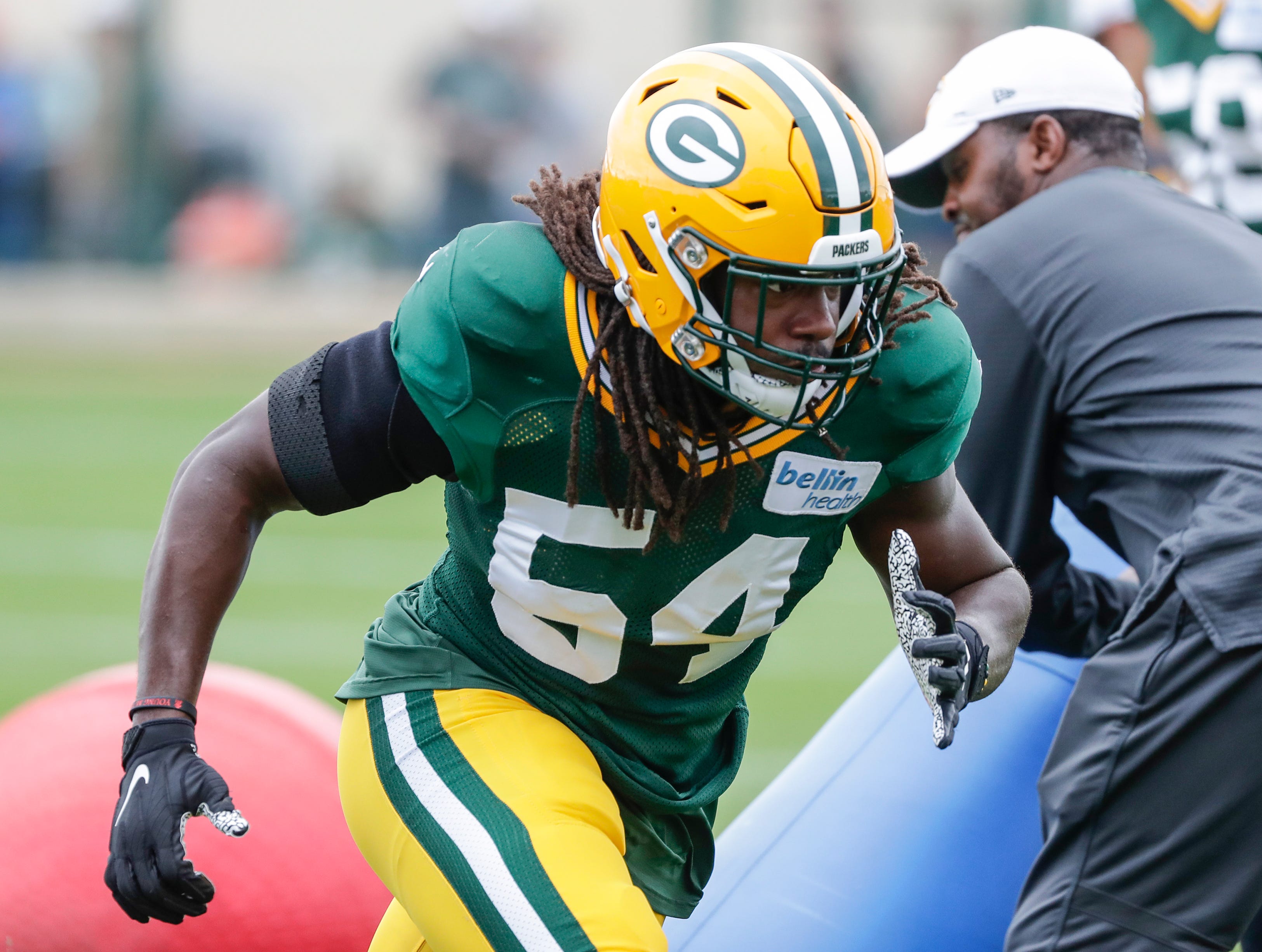 Green Bay Packers' James Crawford runs a drill during training camp practice Tuesday, August 13, 2019, at Ray Nitschke Field in Ashwaubenon, Wis.