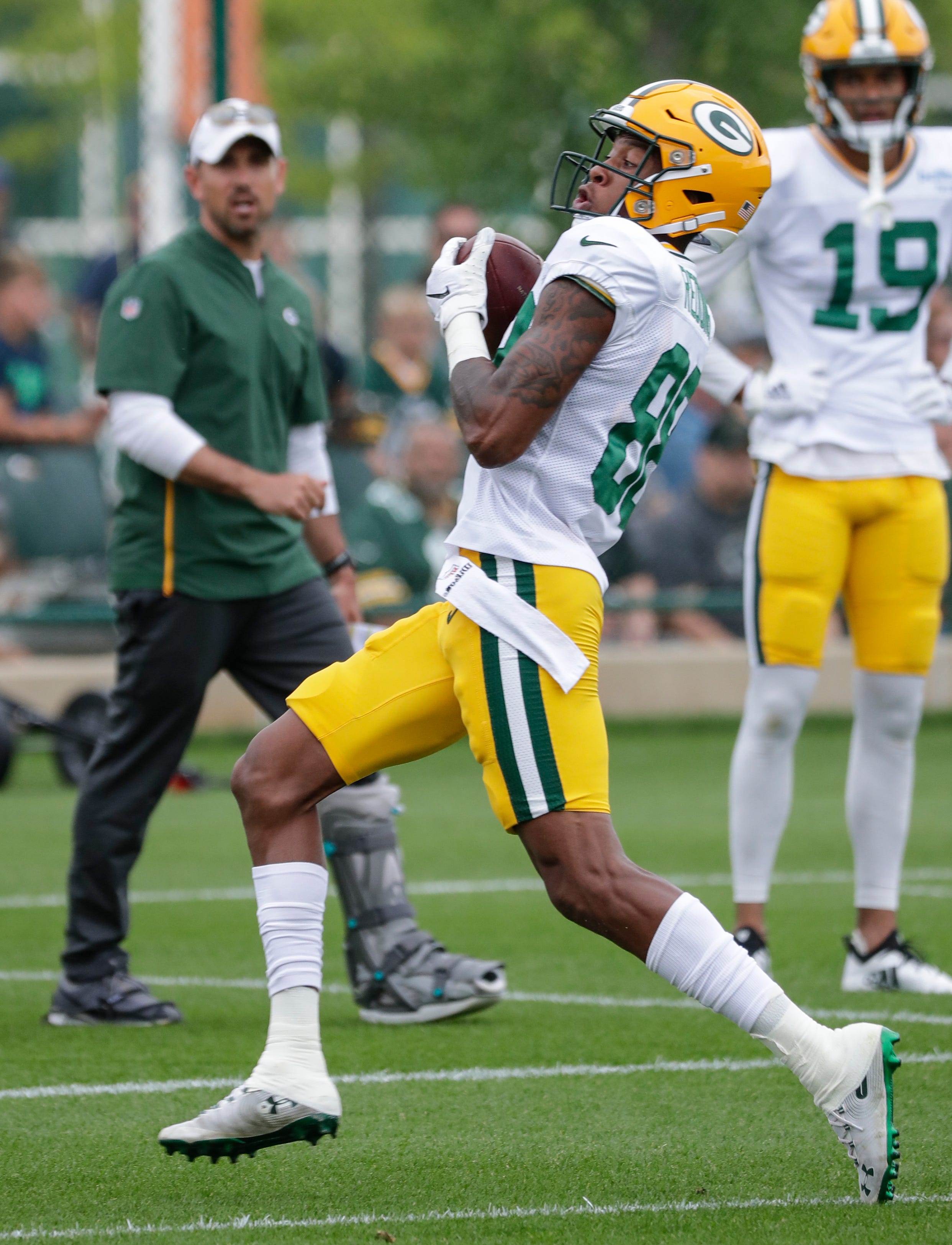 Green Bay Packers' Teo Redding catches a pass during training camp practice Tuesday, August 13, 2019, at Ray Nitschke Field in Ashwaubenon, Wis.