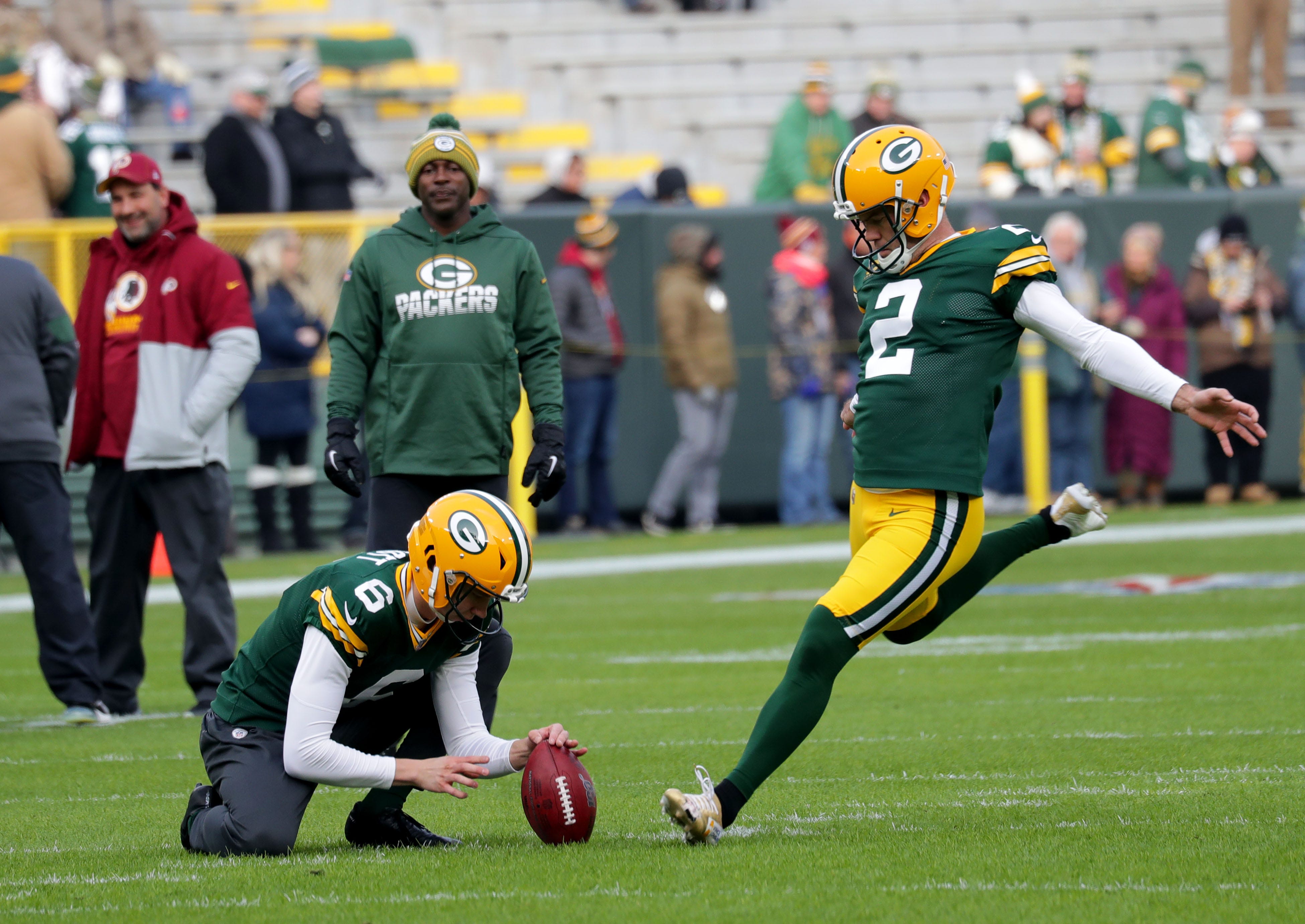 Green Bay Packers kicker Mason Crosby (2) kicks a field goal as Green Bay Packers punter J.K. Scott (6) holds before the Green Bay Packers football game against the Washington Redskins at Lambeau Field in Green Bay  on Sunday, Dec. 8, 2019.  Photo by Mike De Sisti/Milwaukee Journal Sentinel