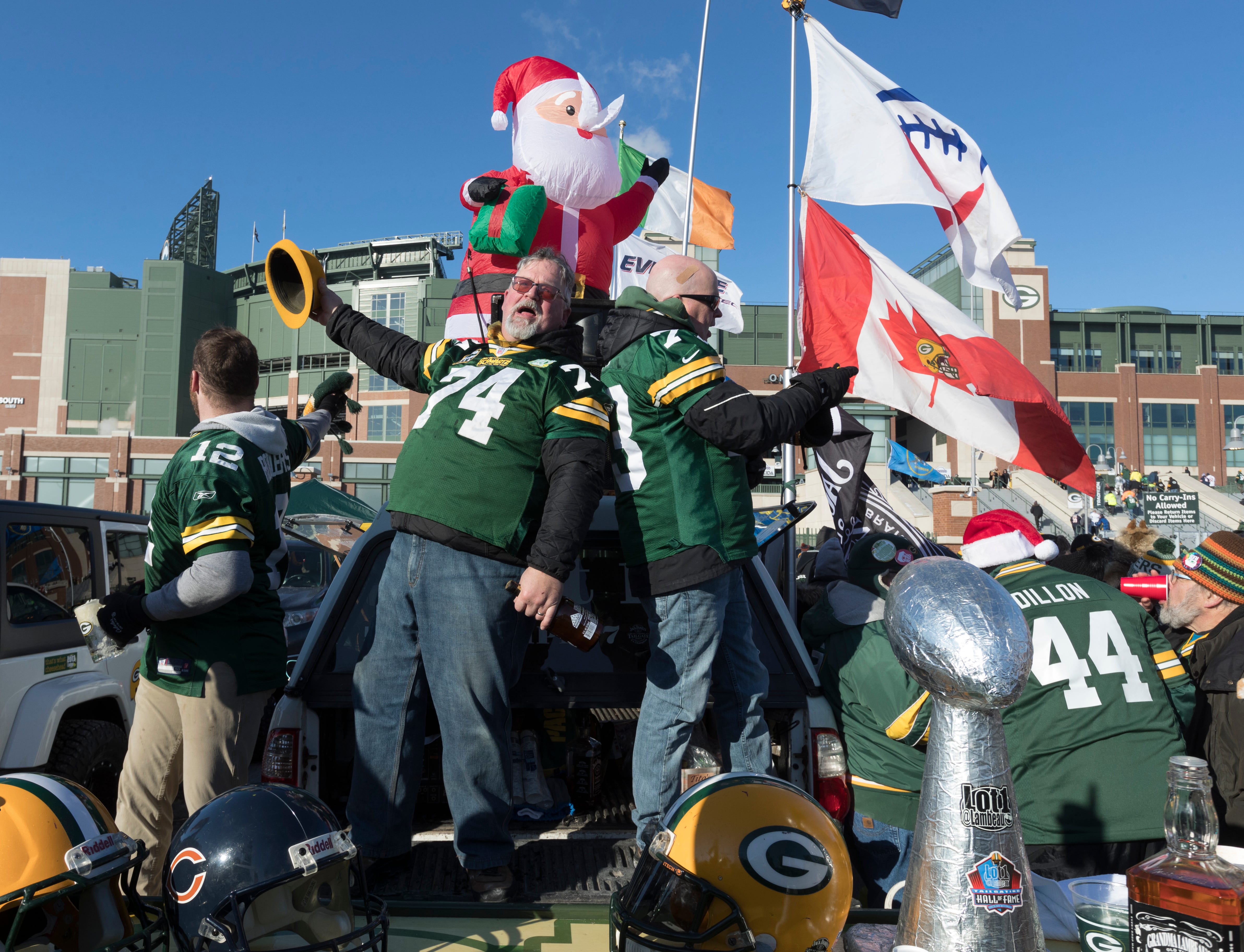 Tailgaters entertain fans with a song before the Green Bay Packers game against the Chicago Bears Sunday, December 15, 2019 at Lambeau Field in Green Bay, Wis. She is from Rochester, NY.