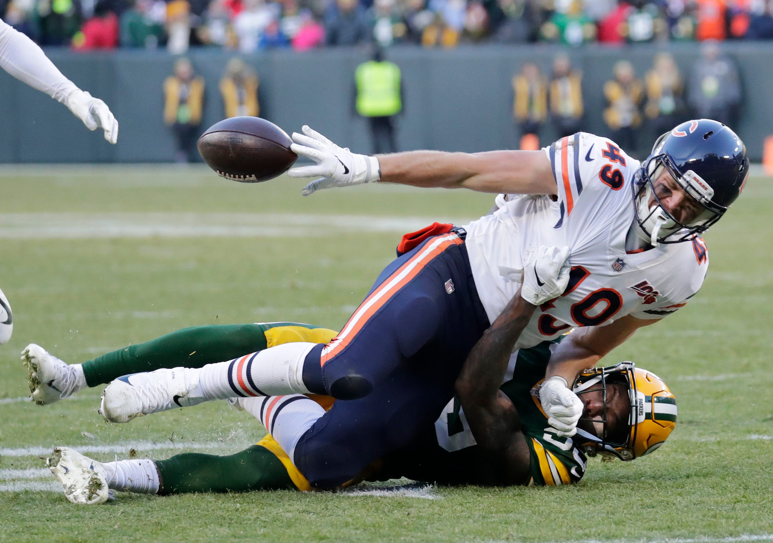 Chicago Bears tight end Jesper Horsted (49) laterals the ball on the last play of the game against Green Bay Packers defensive back Chandon Sullivan (39) Sunday, December 15, 2019, at Lambeau Field in Green Bay, Wis. Tramon Williams (38) recovered the ball to end the game.