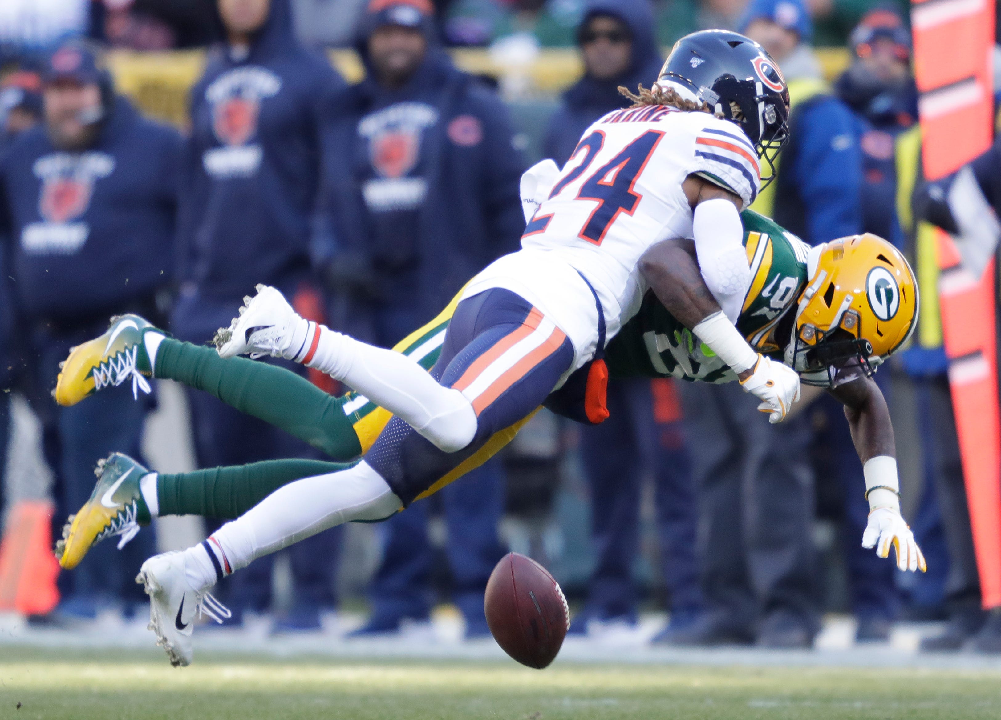 Green Bay Packers wide receiver Geronimo Allison (81) drops a pass as he is hit by Chicago Bears cornerback Buster Skrine (24) Sunday, December 15, 2019, at Lambeau Field in Green Bay, Wis.