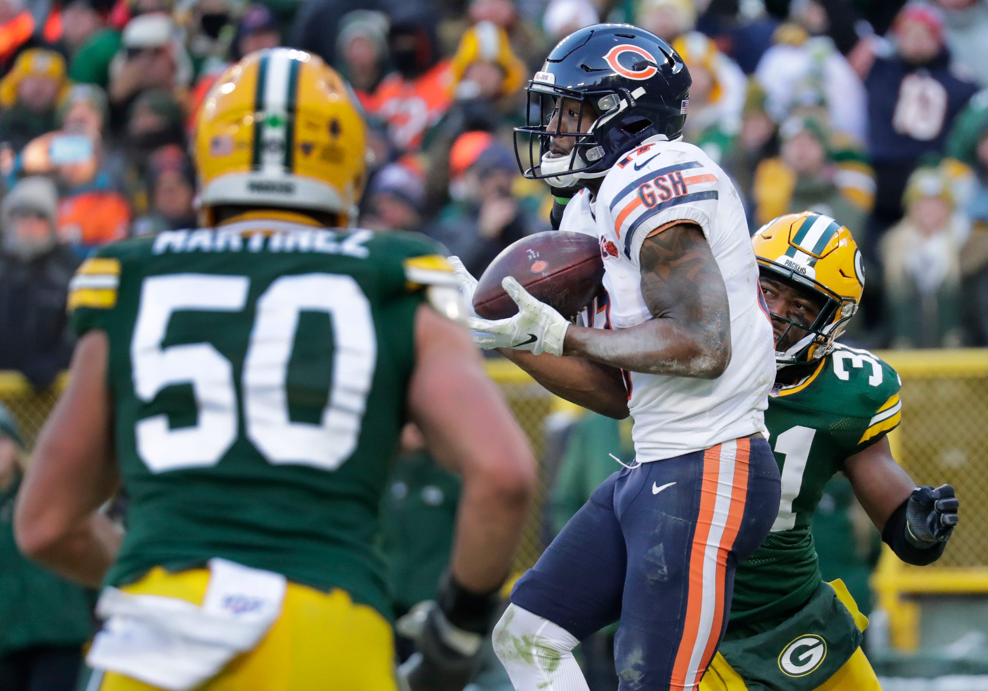 Chicago Bears wide receiver Anthony Miller (17) scores a touchdown in front of Green Bay Packers inside linebacker Blake Martinez (50) and Adrian Amos (31) in the fourth quarter Sunday, December 15, 2019, at Lambeau Field in Green Bay, Wis.