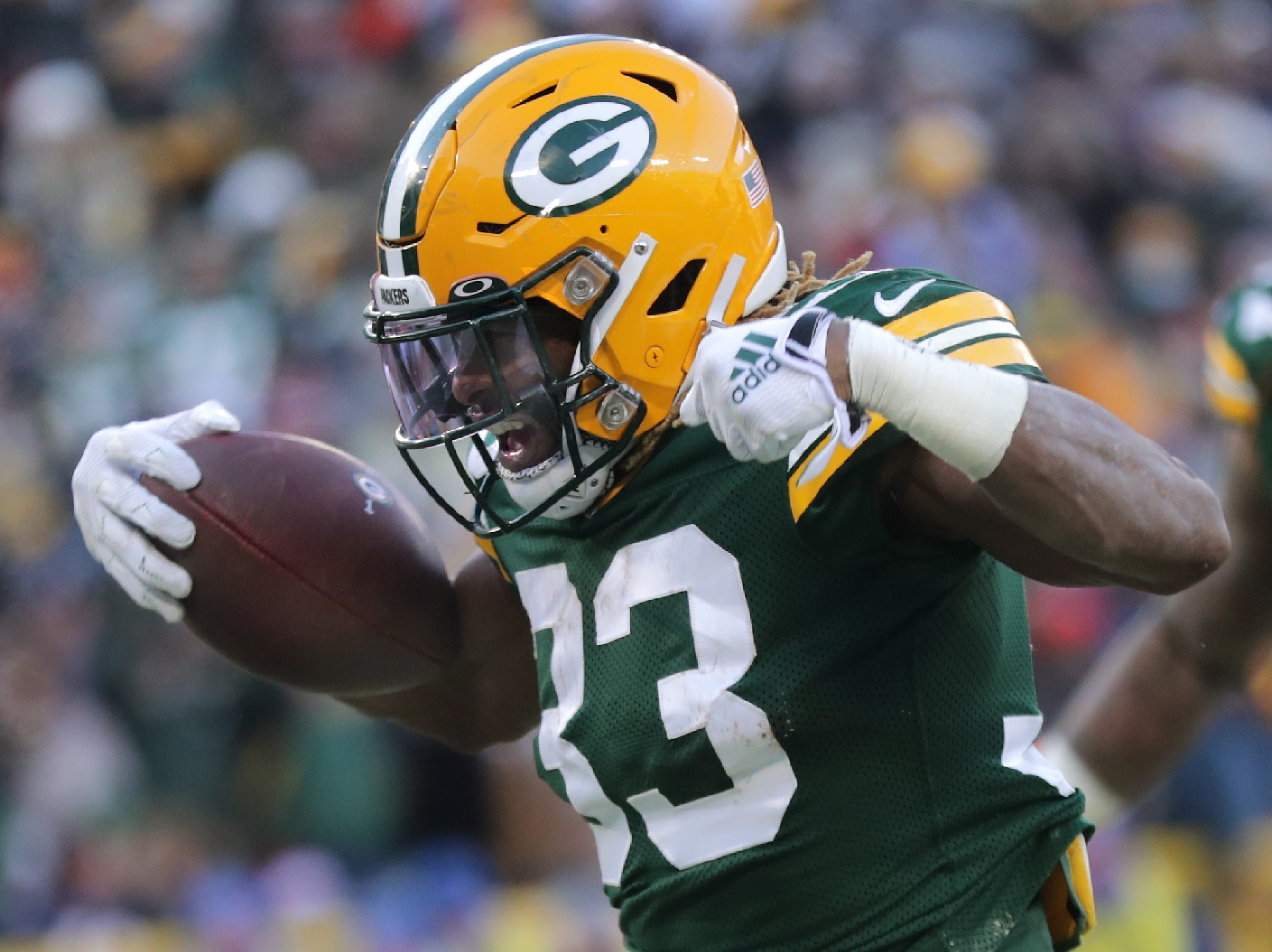 Green Bay Packers running back Aaron Jones (33) reacts after rushing for a third quarter touchdown against the Chicago Bears during their football game on Sunday, December 15, 2019, at Lambeau Field in Green Bay, Wis.