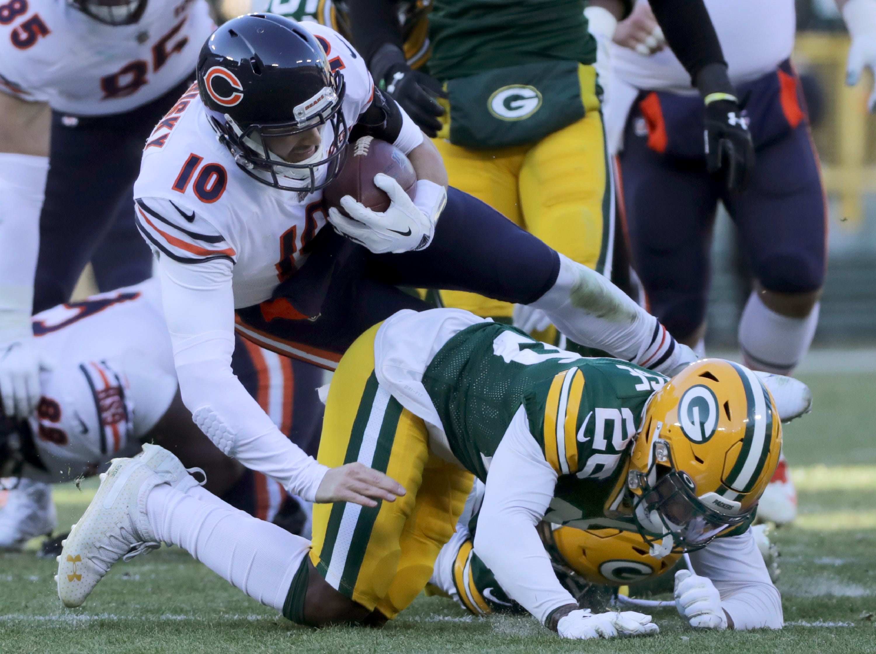 Chicago Bears quarterback Mitchell Trubisky (10) is tackled by Green Bay Packers free safety Darnell Savage (26) during their football game on Sunday, December 15, 2019, at Lambeau Field in Green Bay, Wis.