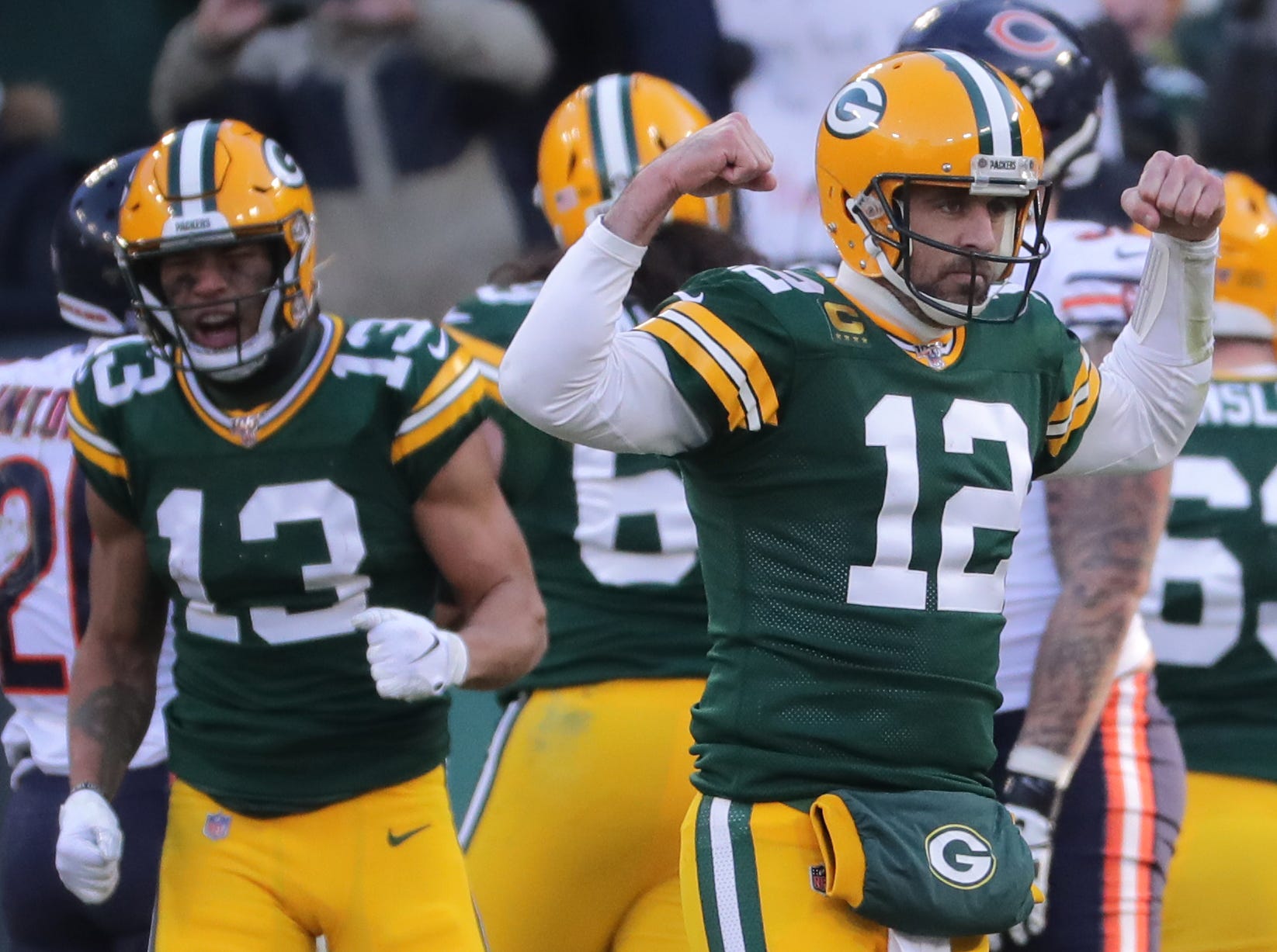 Green Bay Packers quarterback Aaron Rodgers (12) reacts after running back Aaron Jones scored a touchdown on a 2-yard run during the third quarter of their game Sunday, December 15, 2019 at Lambeau Field in Green Bay, Wis. The Green Bay Packers beat the Chicago Bears 21-13.