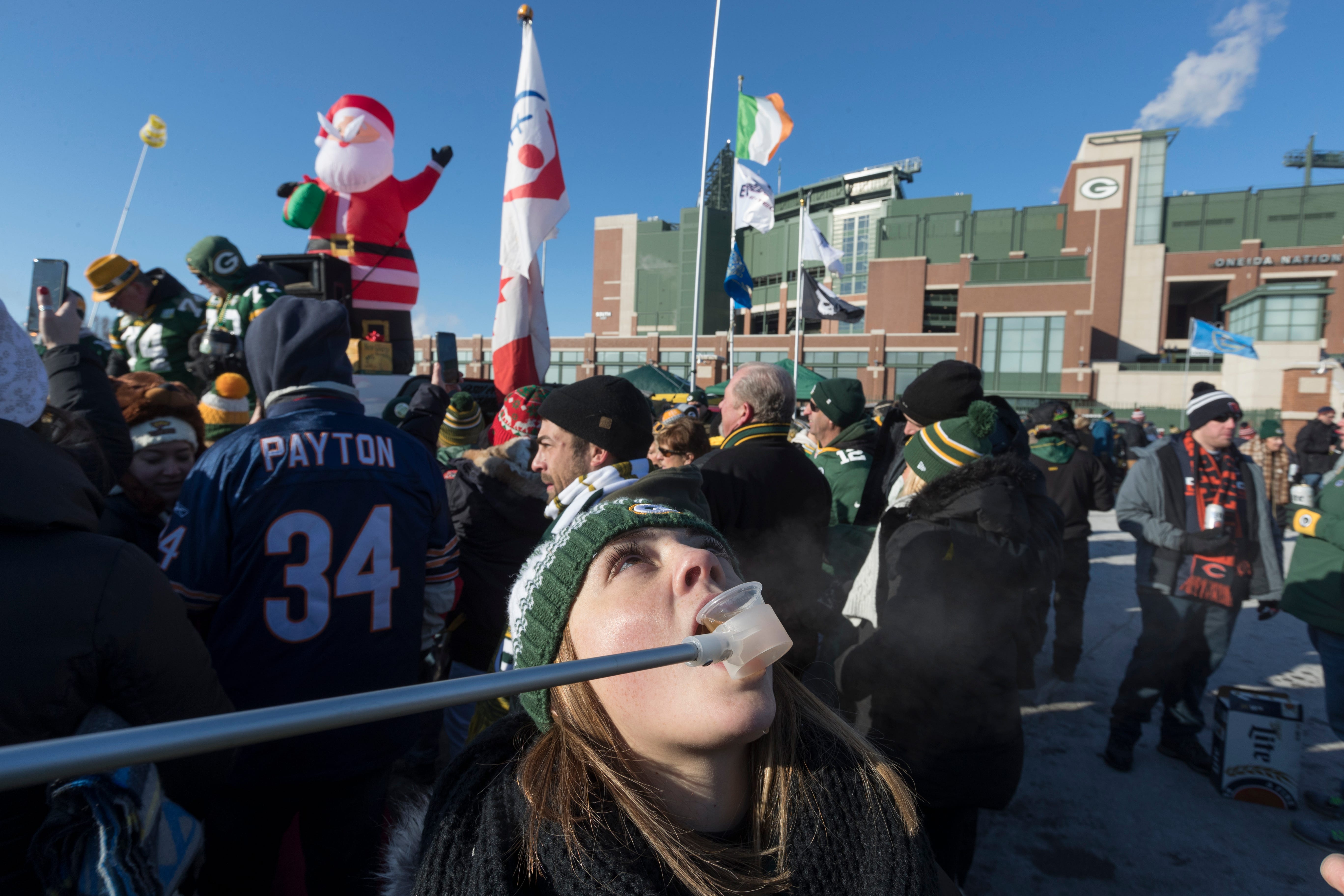 Carley Argentieri is delivered a shot on long pole while tailgating before the Green Bay Packers game against the Chicago Bears Sunday, December 15, 2019 at Lambeau Field in Green Bay, Wis. She is from Rochester, NY.
