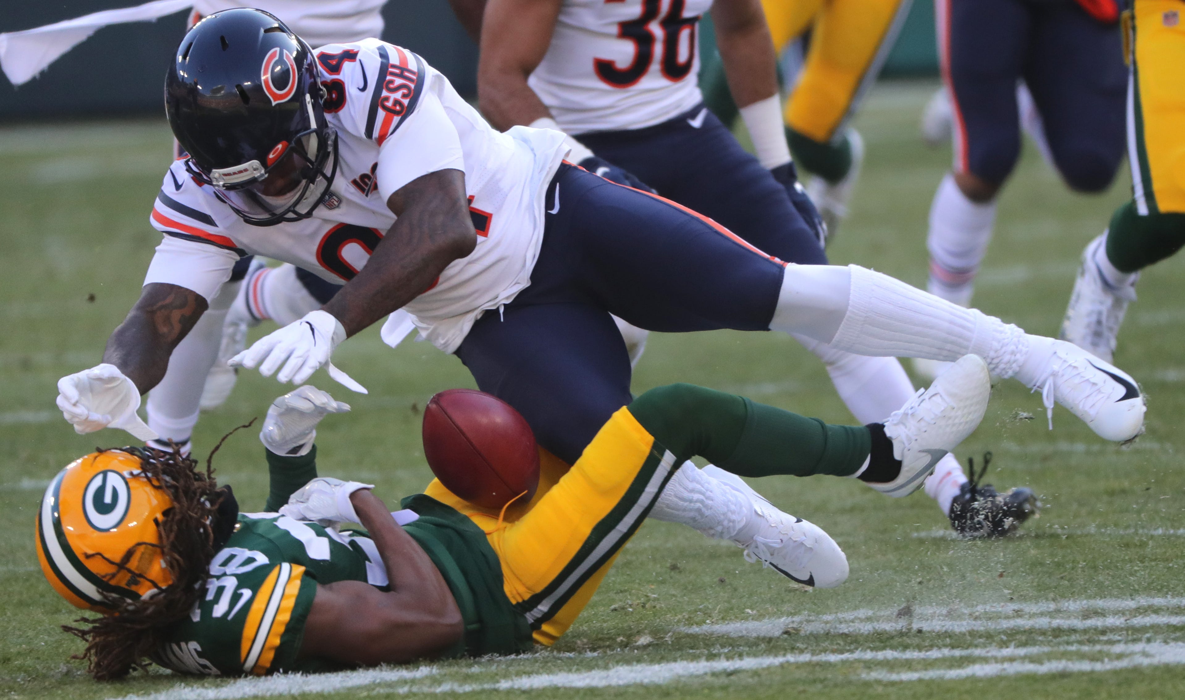 Chicago Bears wide receiver Cordarrelle Patterson (84) drills Green Bay Packers cornerback Tramon Williams (38) while field a punt during the first quarter of their game Sunday, December 15, 2019 at Lambeau Field in Green Bay, Wis. The Bears were penalized for interference on the play.

MARK HOFFMAN/MILWAUKEE JOURNAL SENTINEL