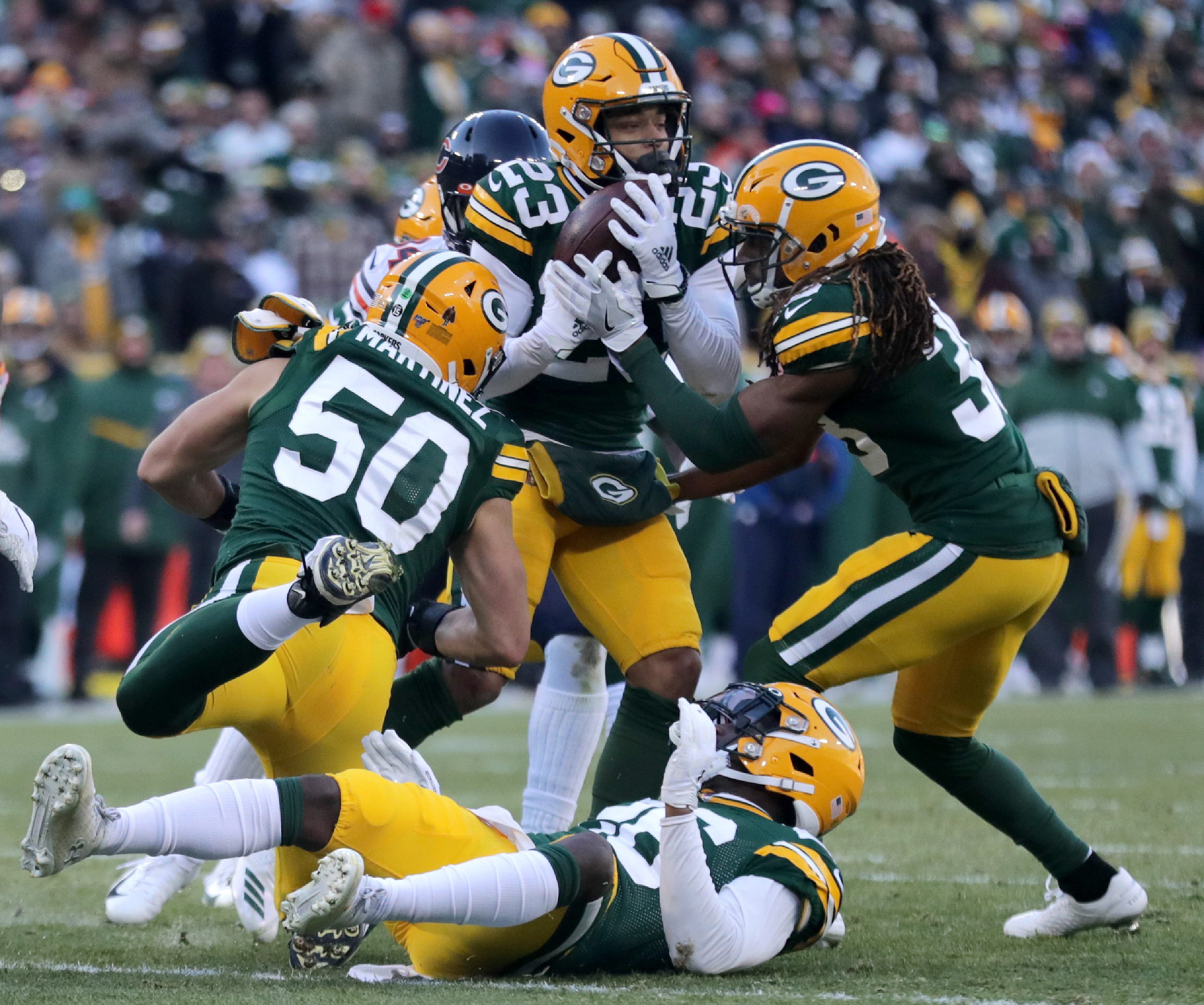 Green Bay Packers cornerback Jaire Alexander (23) intercepts a late second quarter pass against the Chicago Bears during their football game on Sunday, December 15, 2019, at Lambeau Field in Green Bay, Wis.