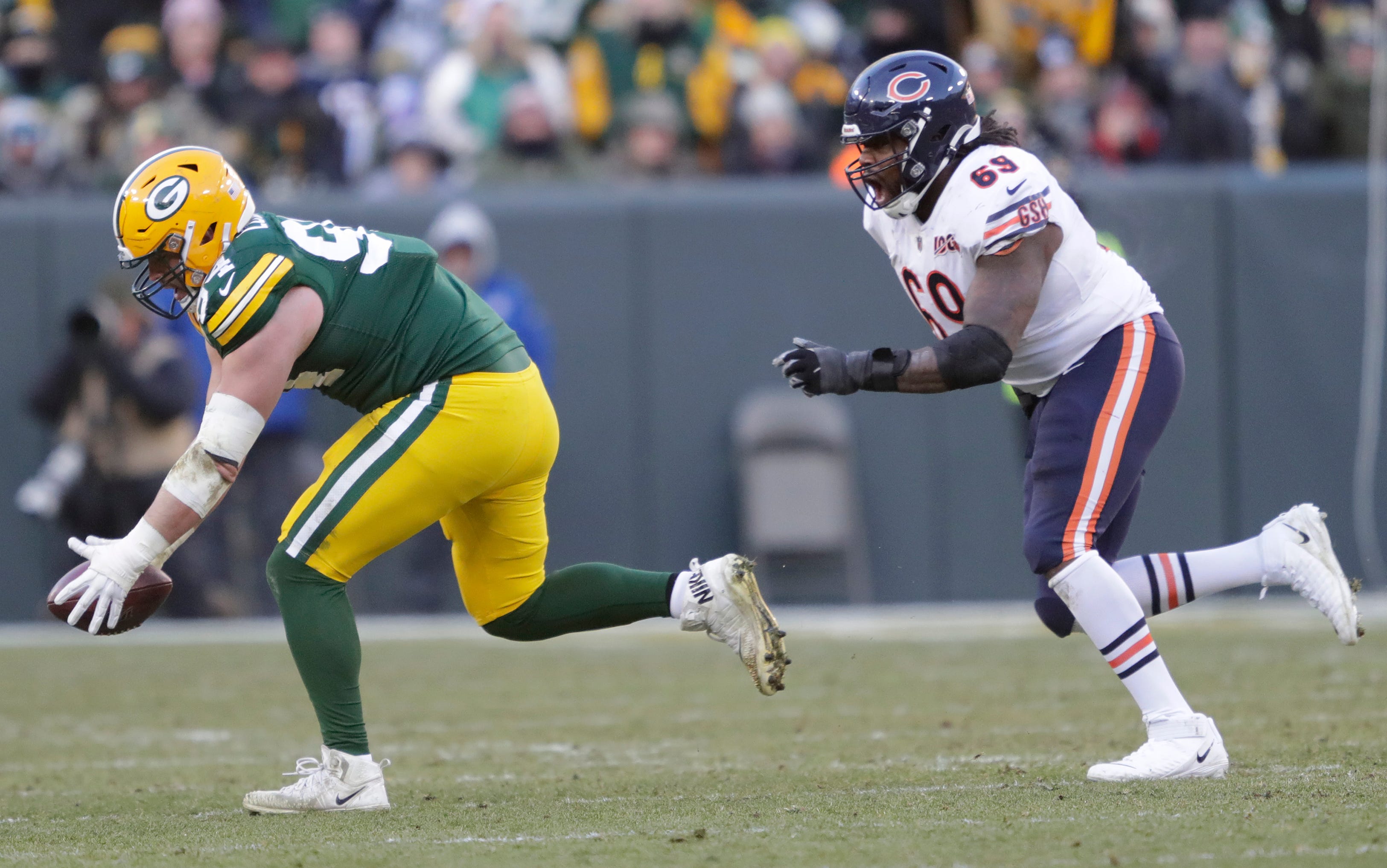 Green Bay Packers defensive end Dean Lowry (94) intercepts a pass against Chicago Bears offensive guard Rashaad Coward (69) in the fourth quarter Sunday, December 15, 2019, at Lambeau Field in Green Bay, Wis.