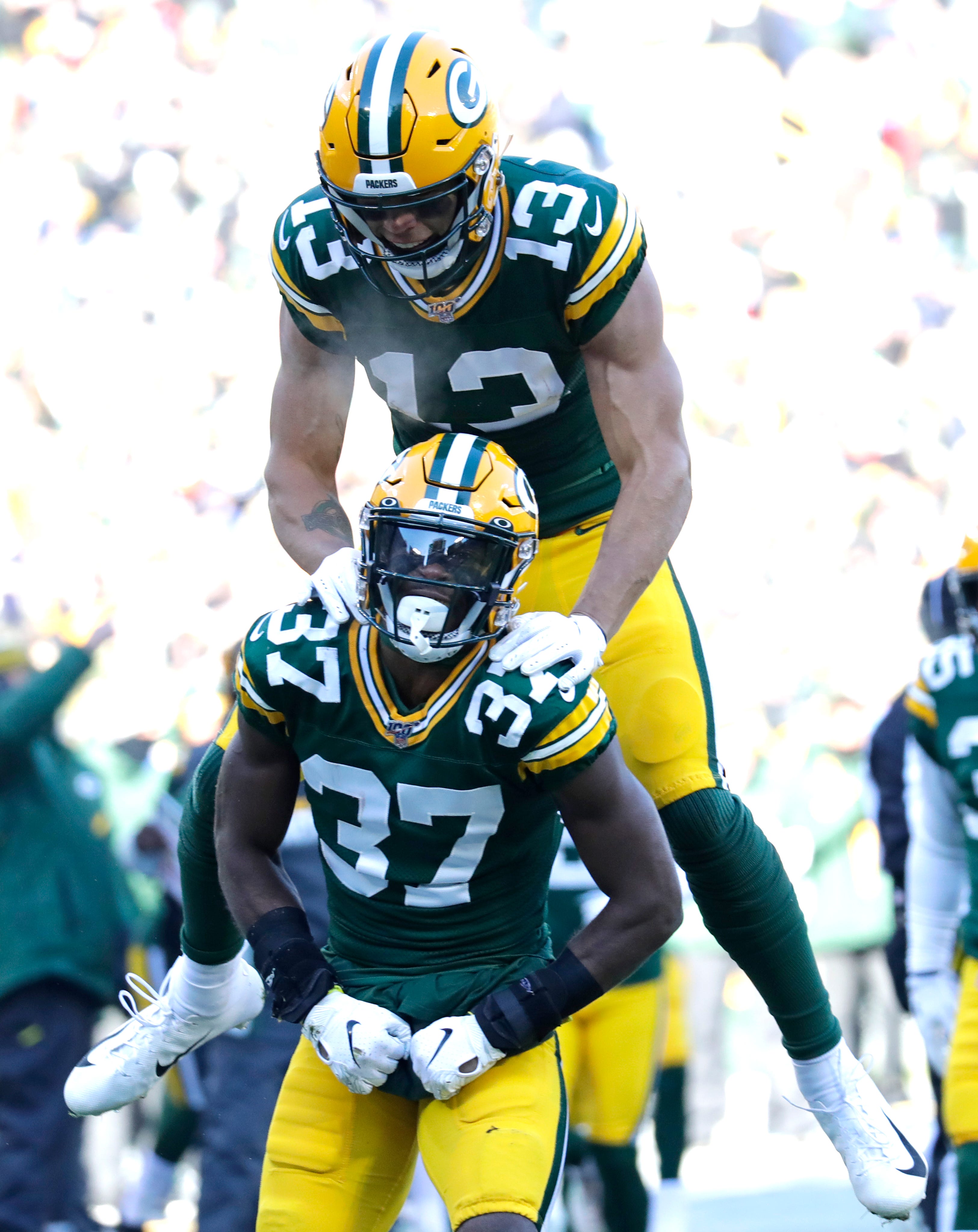 Green Bay Packers cornerback Josh Jackson (37) celebrates making a tackle on the kickoff with Allen Lazard (13) in the first quarter against the Chicago Bears Sunday, December 15, 2019, at Lambeau Field in Green Bay, Wis.