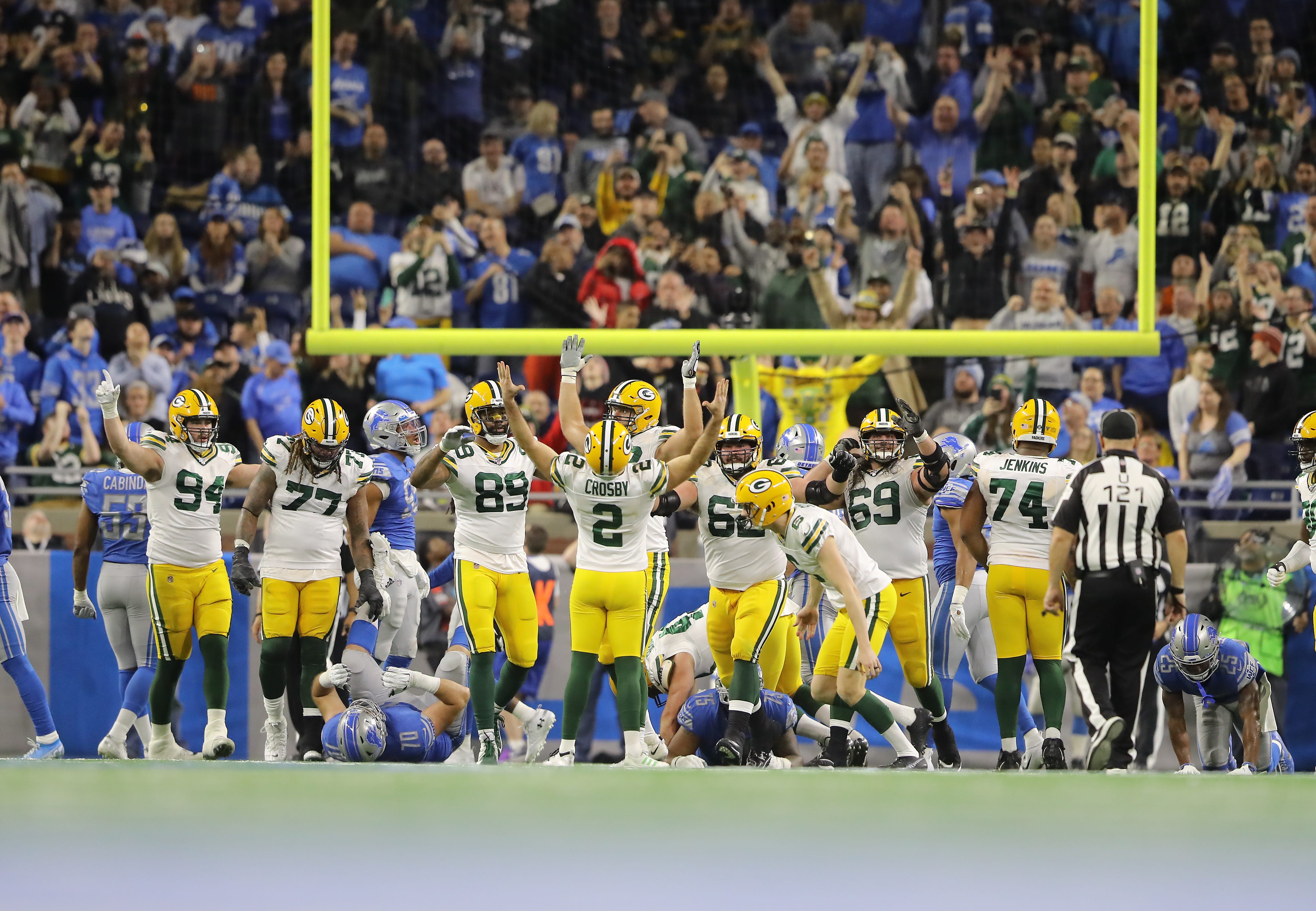 Mason Crosby #2 of the Green Bay Packers celebrates his game winning field against the Detroit Lions at Ford Field on December 29, 2019 in Detroit, Michigan. Green Bay Packers defeated Detroit Lions 23 - 20